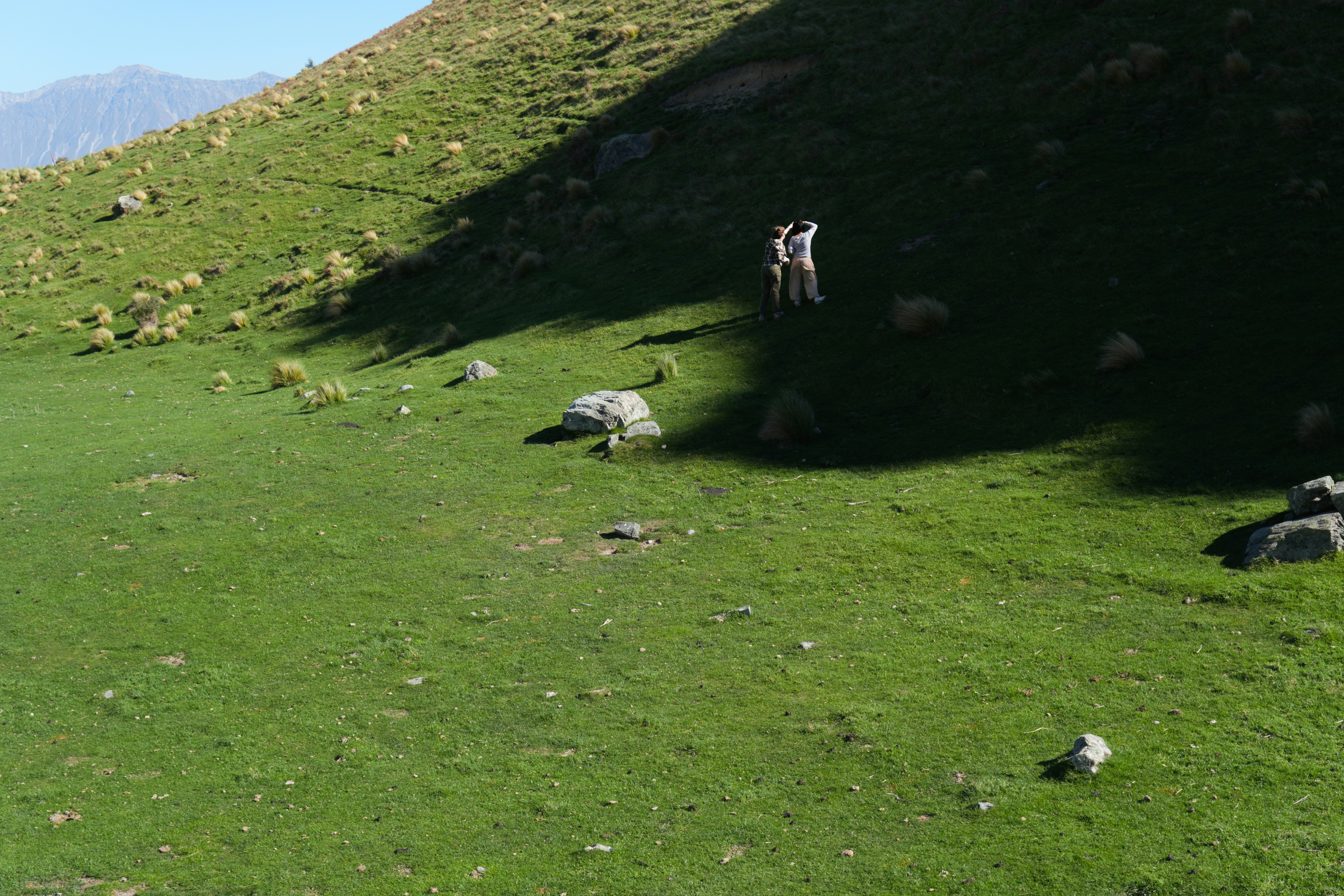 People walking on Ashburton Lakes hillside - Free Photo on Unsplash