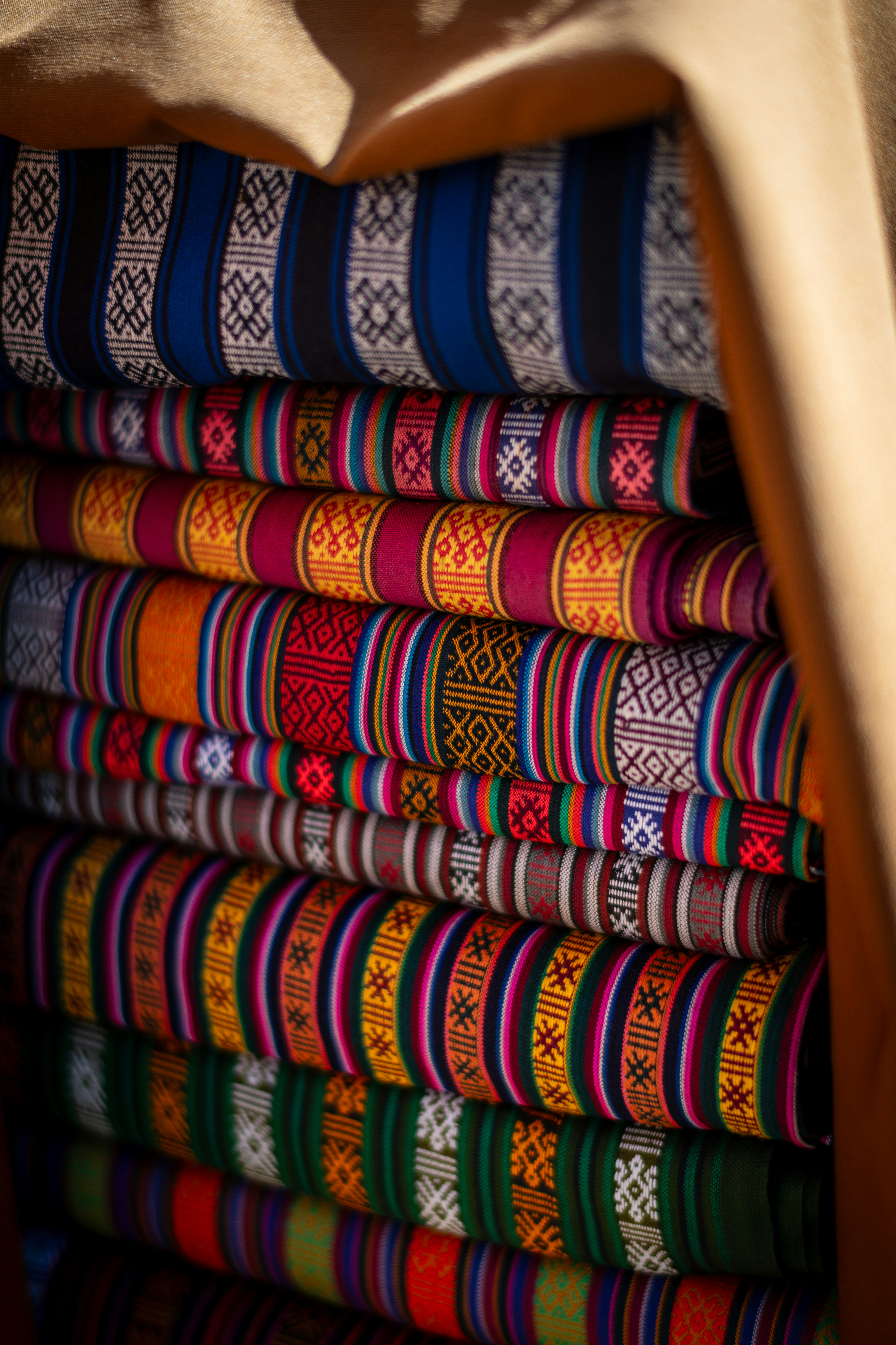 Folded colorful textiles with geometric patterns - Free Photo on Unsplash