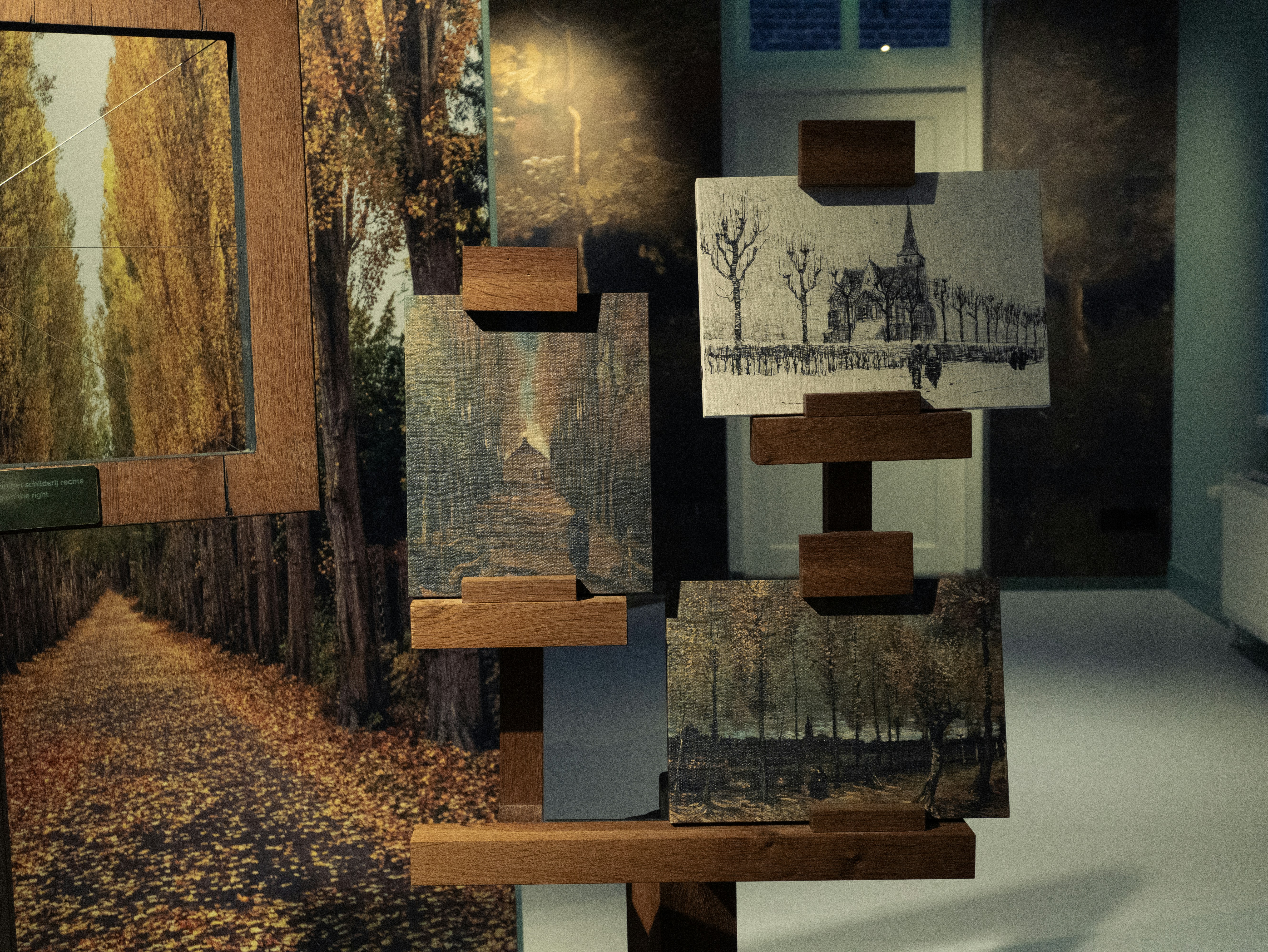 Framed landscape paintings on display stand - Free Photo on Unsplash