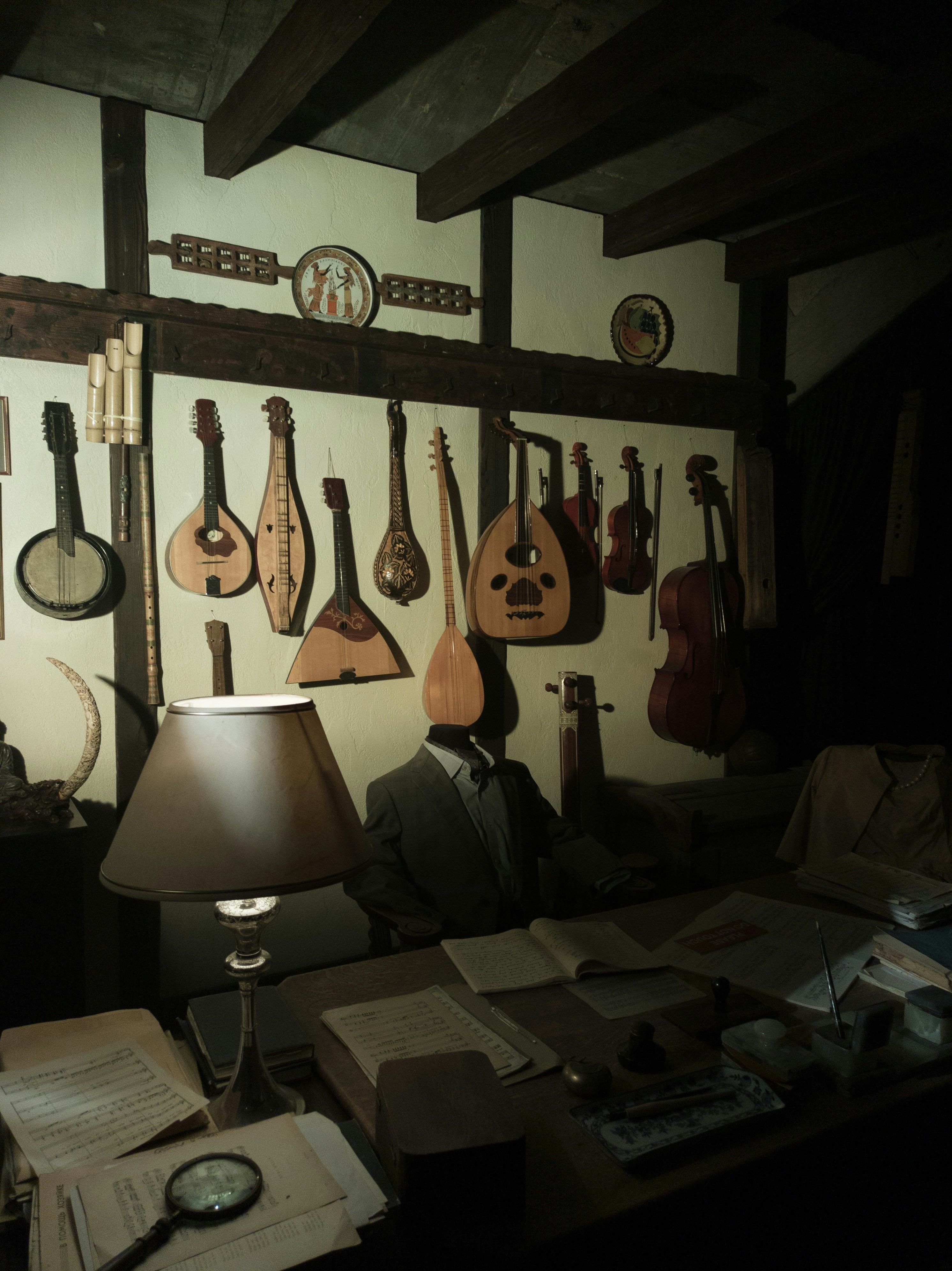 Musical instruments hanging above desk - Free Photo on Unsplash