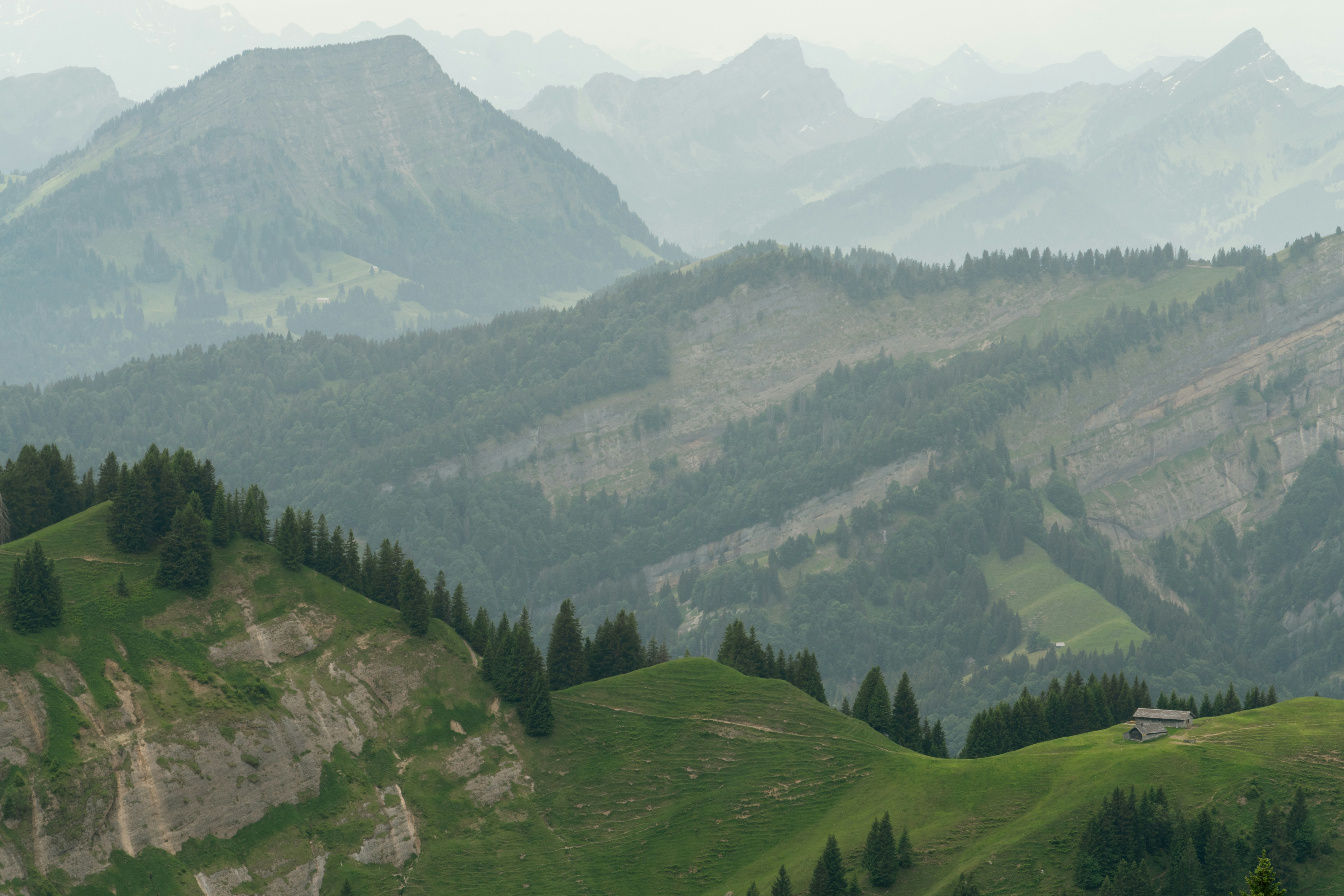 Wooden cabin on green mountain slope - Free Photo on Unsplash