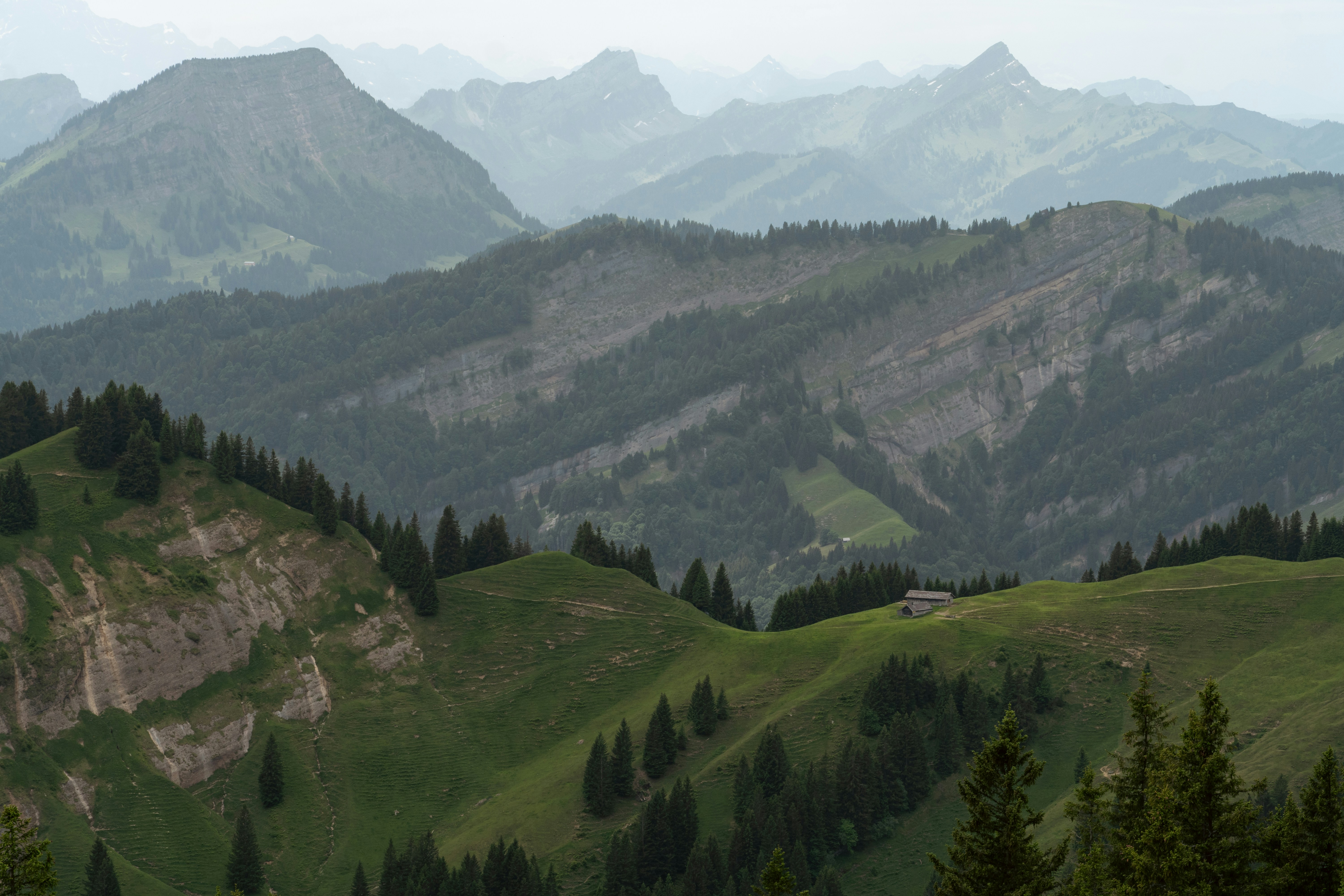 Wooden cabin on green mountain slope - Free Photo on Unsplash