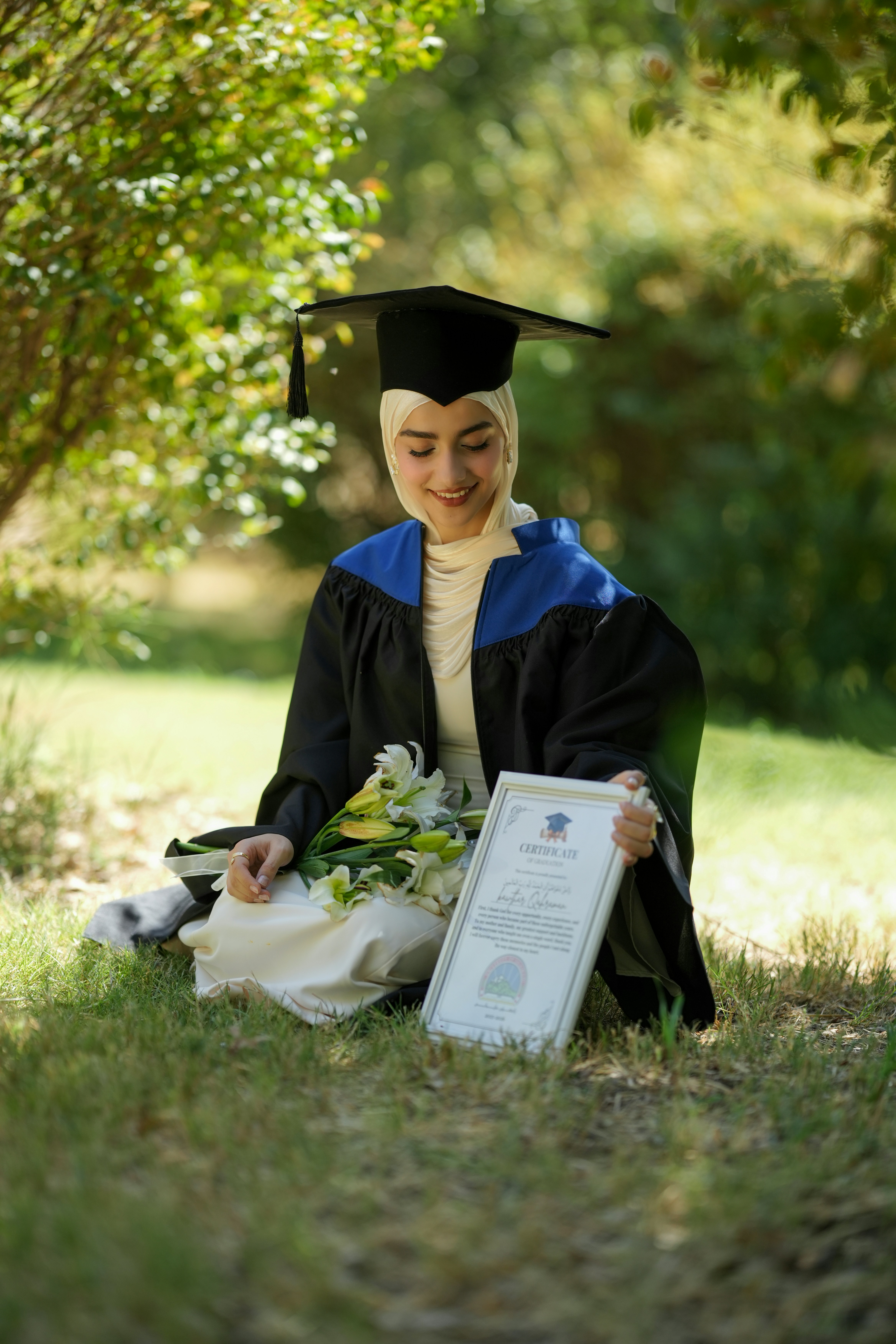 Woman in graduation gown holding certificate - Free Photo on Unsplash