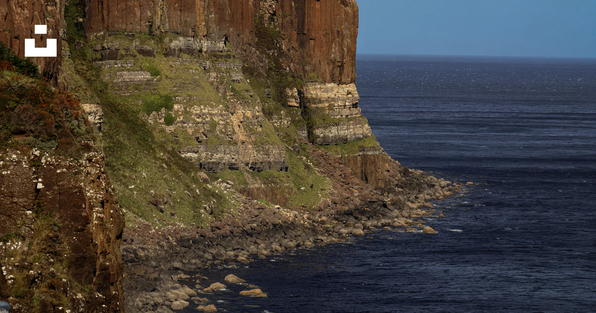 Basalt Rocks Photos Basalt cliffs above dark blue sea - Free Photo on Unsplash