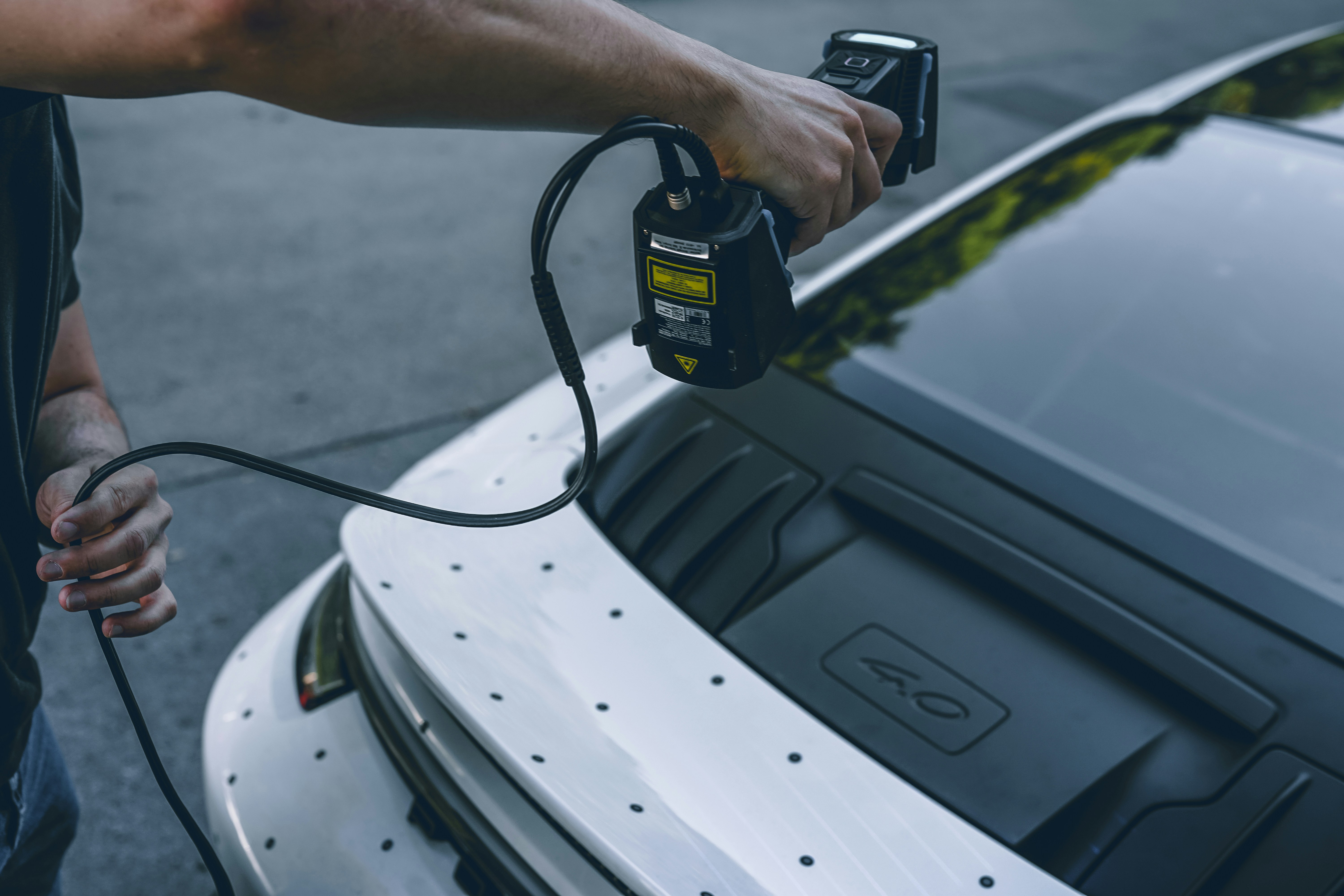 Person using 3D laser scanner on car - Free Photo on Unsplash