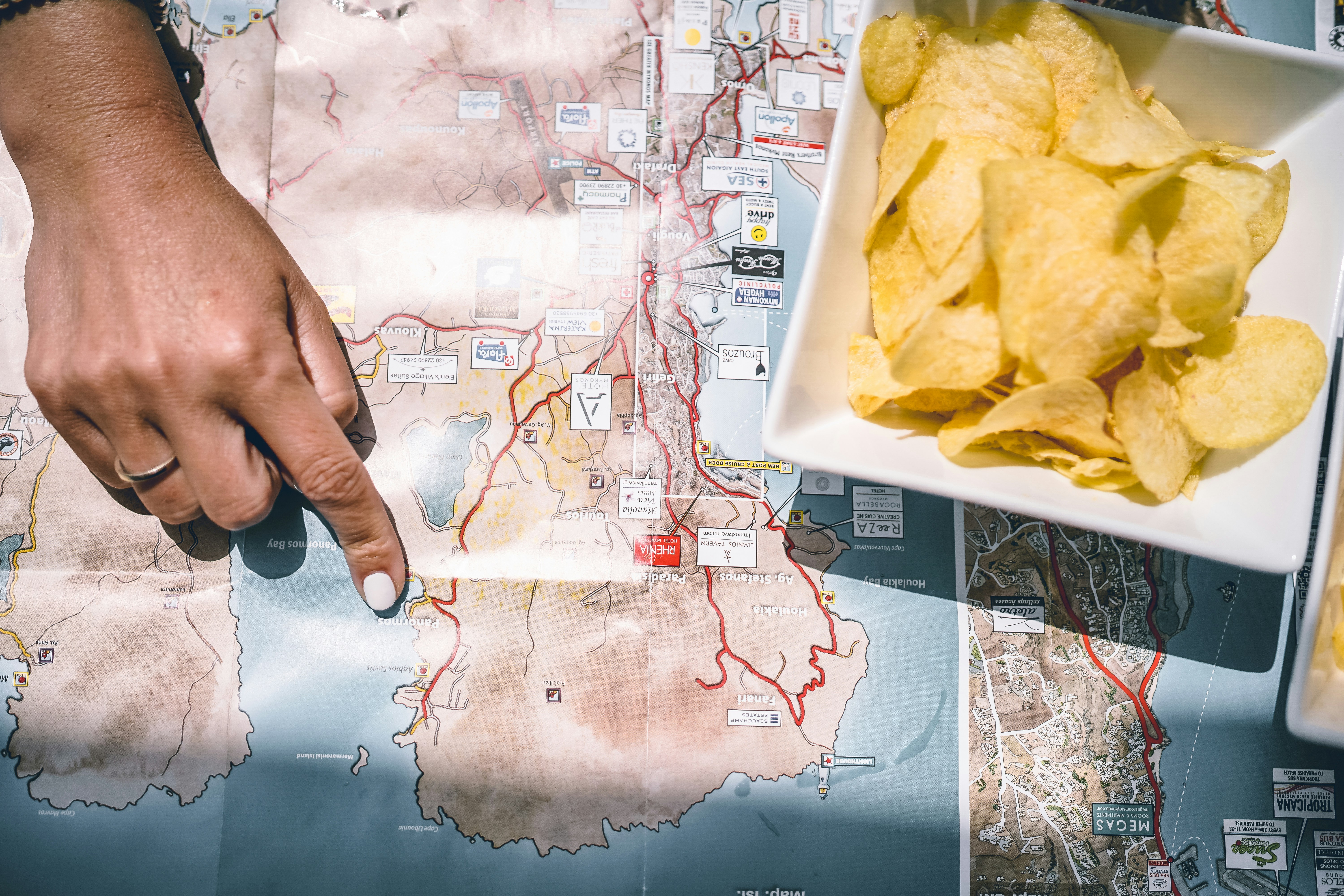 Person pointing at Mykonos map - Free Photo on Unsplash