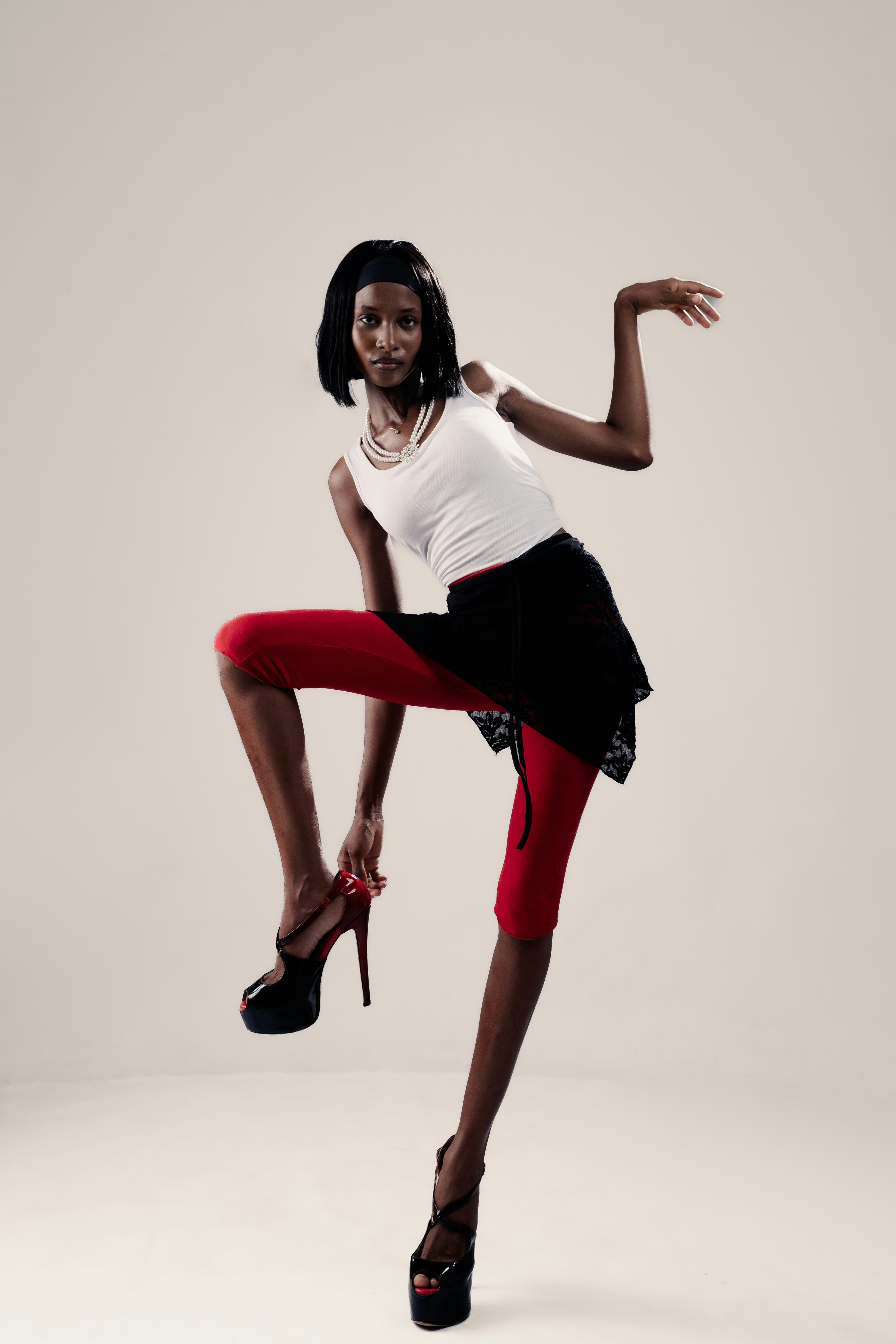 Woman in red leggings adjusting heel - Free Photo on Unsplash