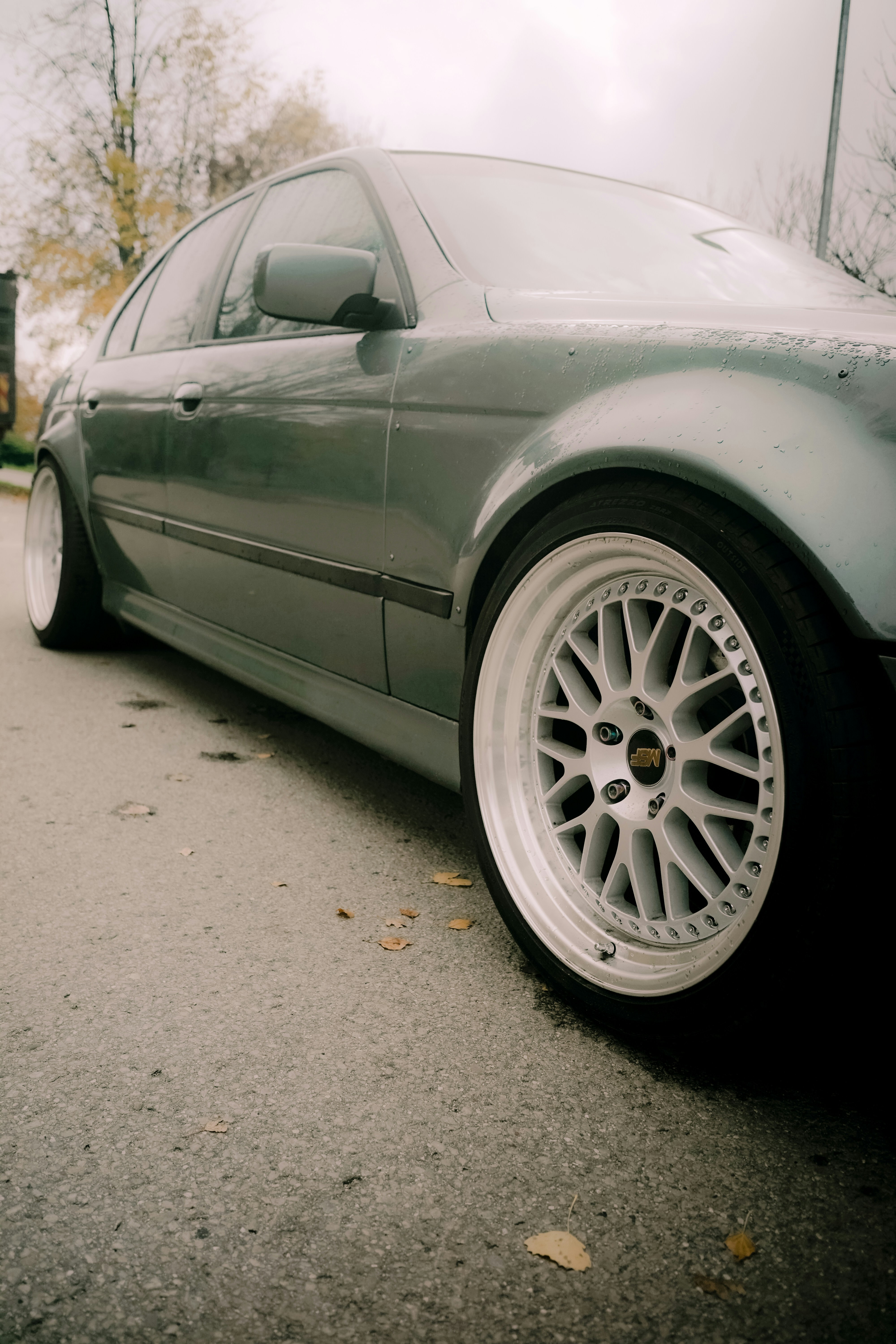 Grey sedan with custom white wheels - Free Photo on Unsplash
