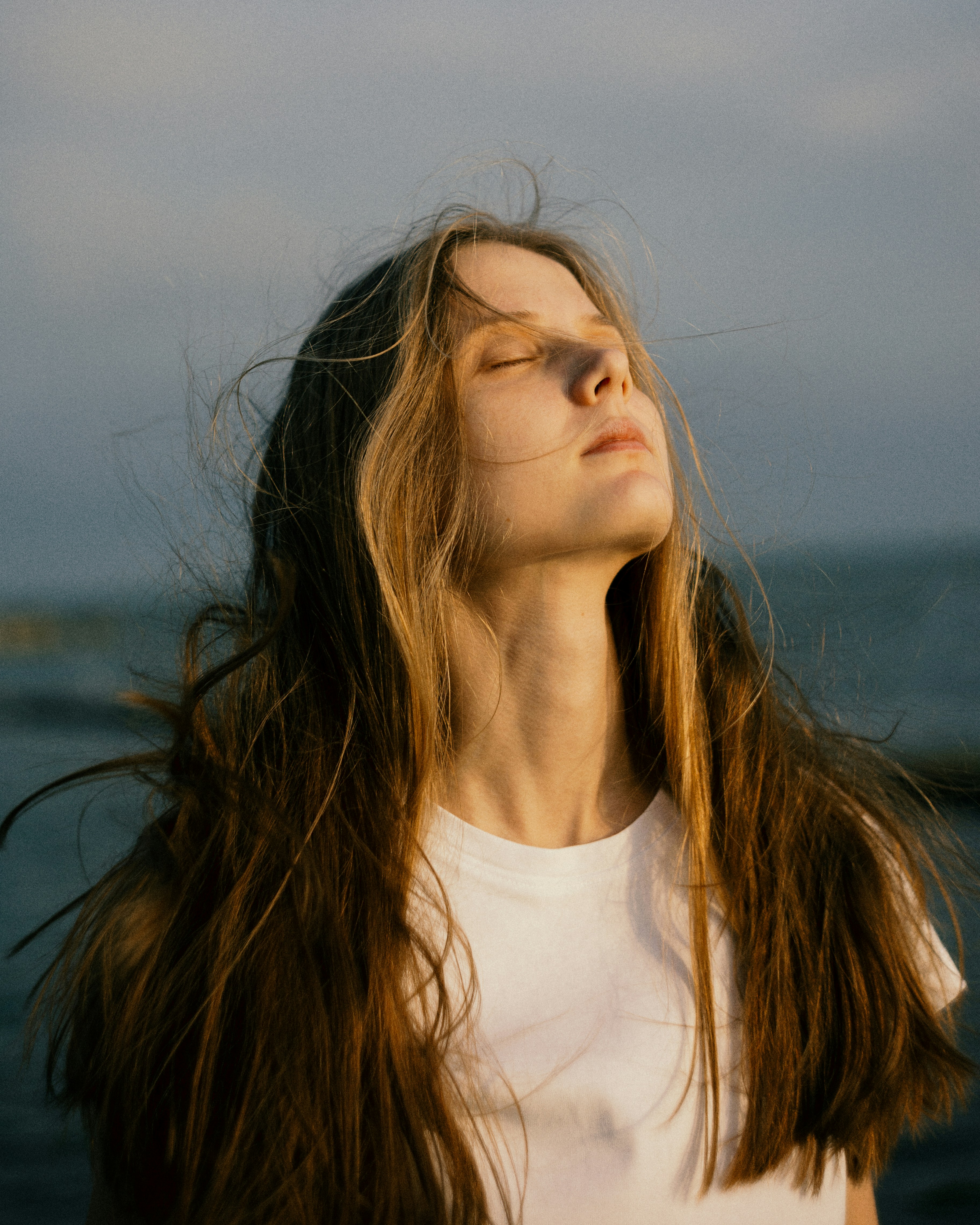 Woman with long hair in golden light - Free Photo on Unsplash