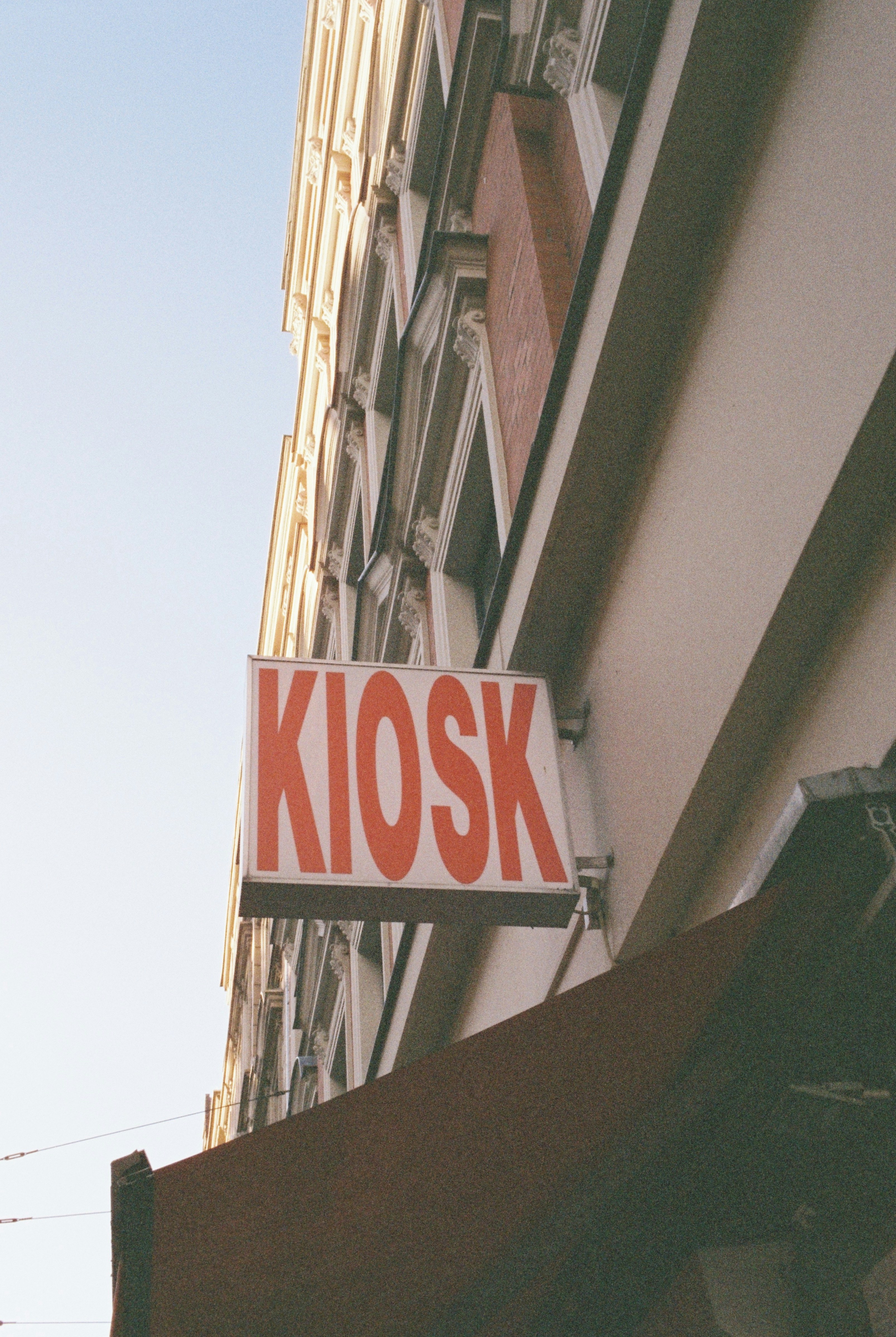Kiosk sign on building facade - Free Photo on Unsplash