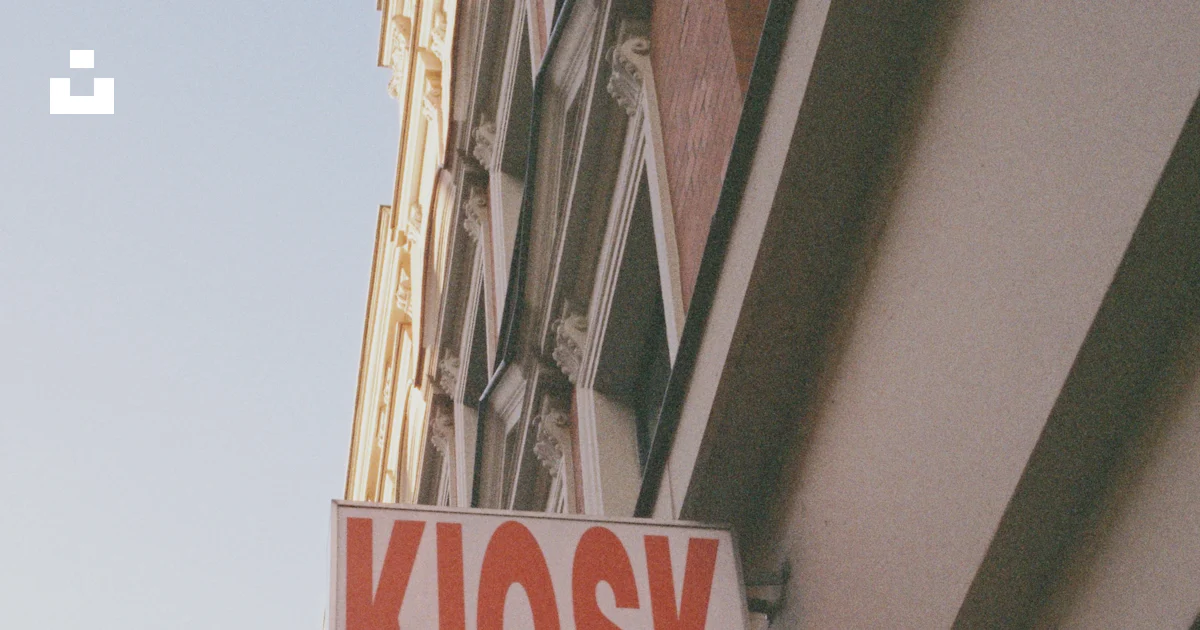 Building Farcade Kiosk sign on building facade - Free Photo on Unsplash