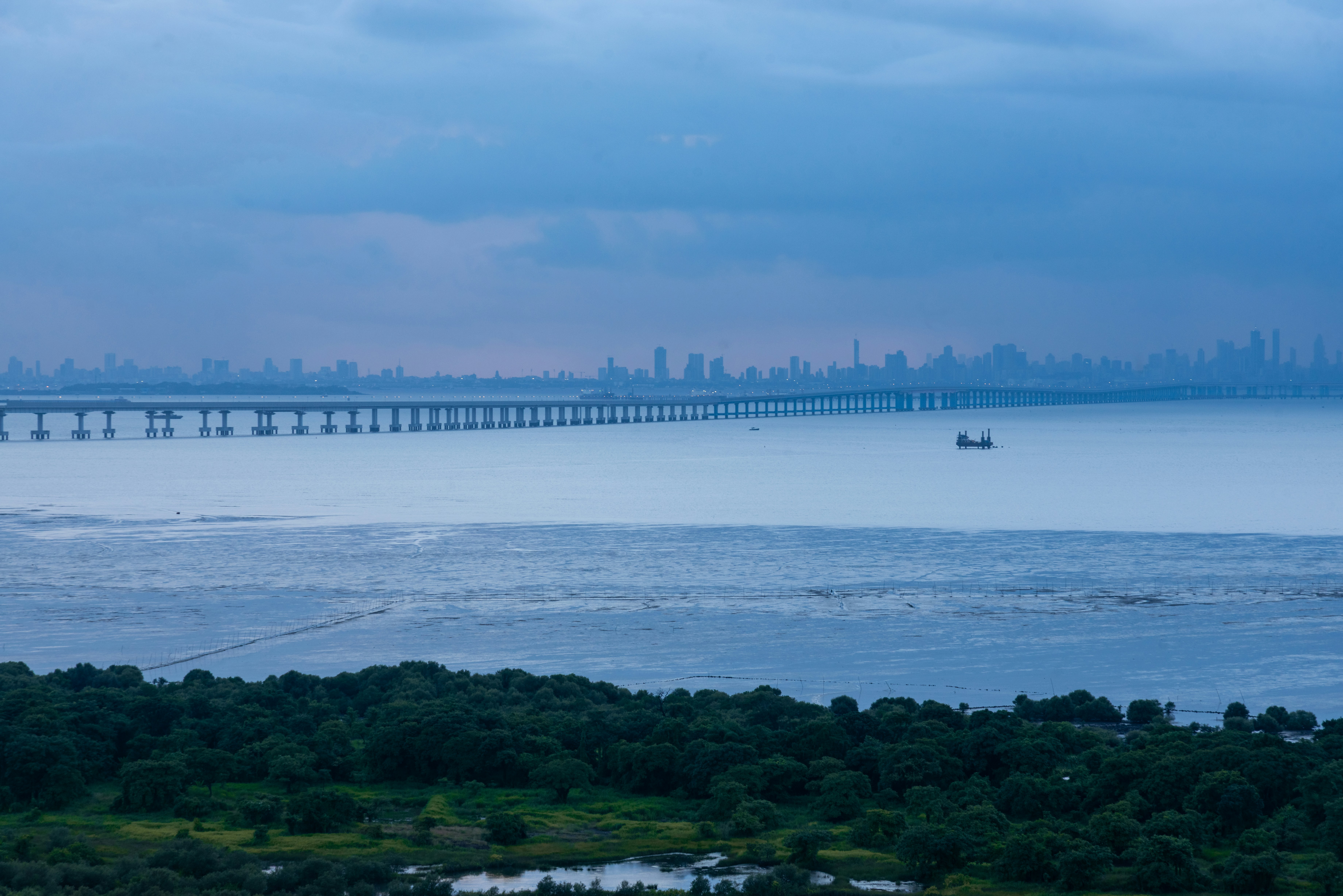 Long bridge across bay with skyline - Free Photo on Unsplash
