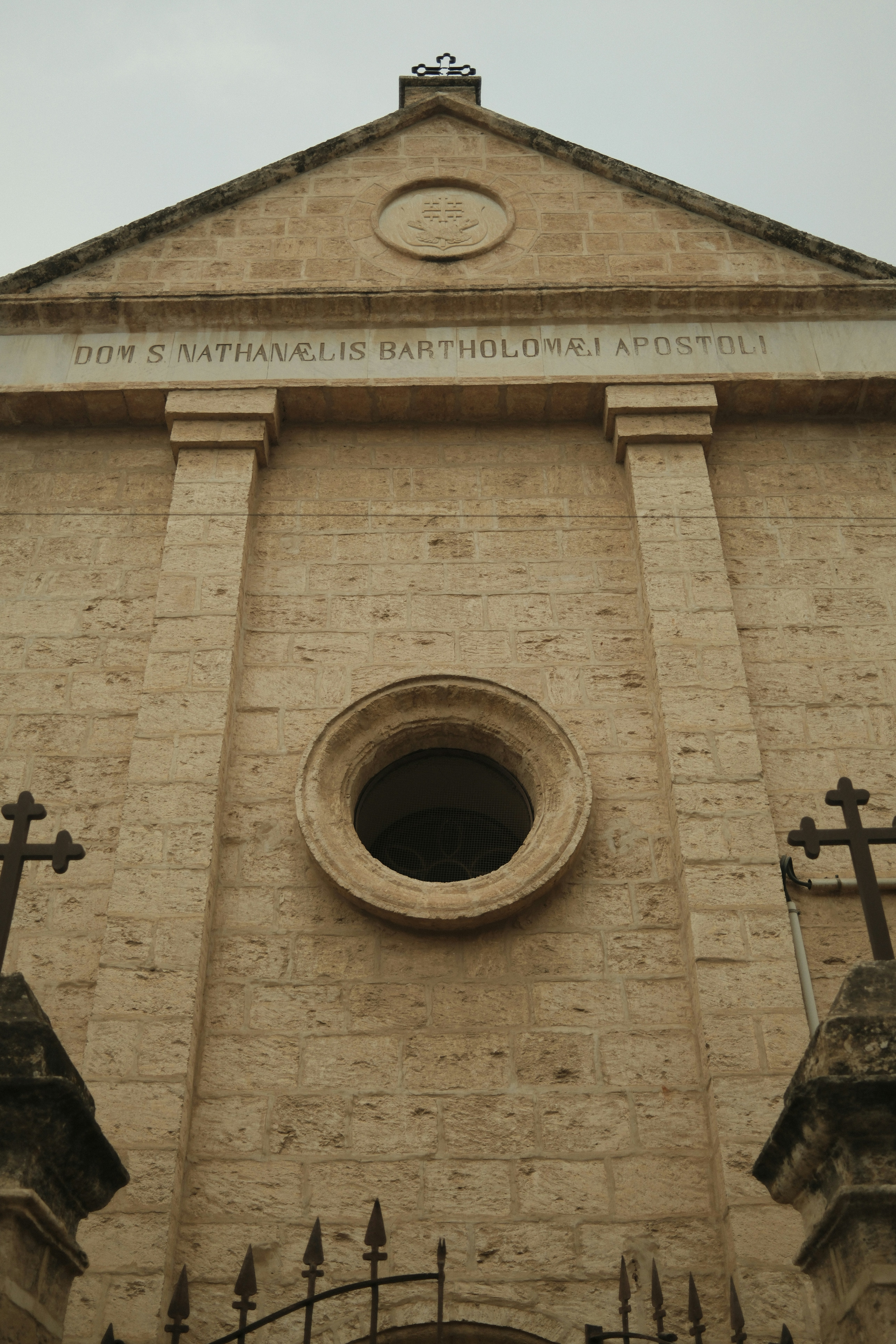Stone church facade with circular window - Free Photo on Unsplash