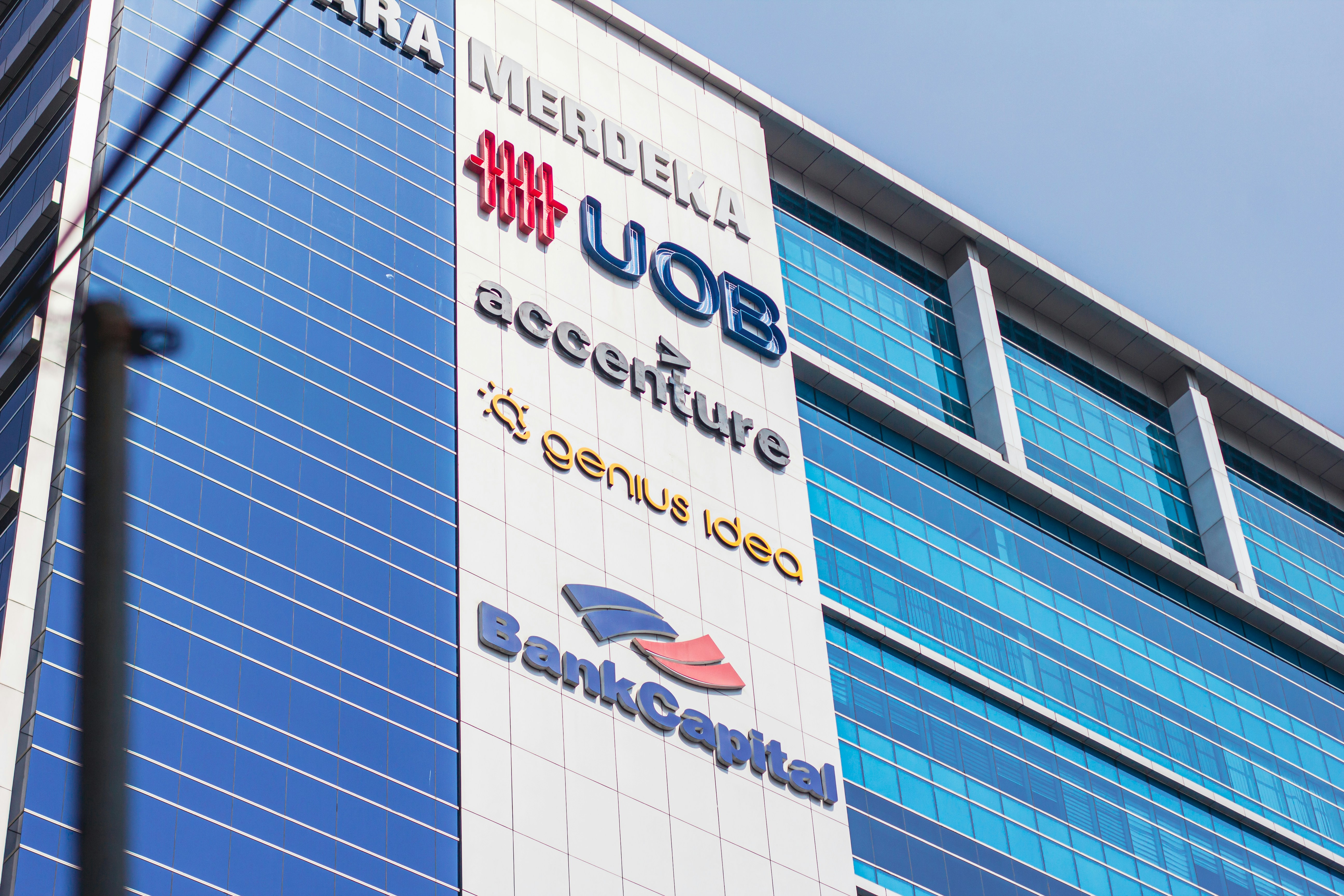 Modern office building with corporate logos - Free Photo on Unsplash