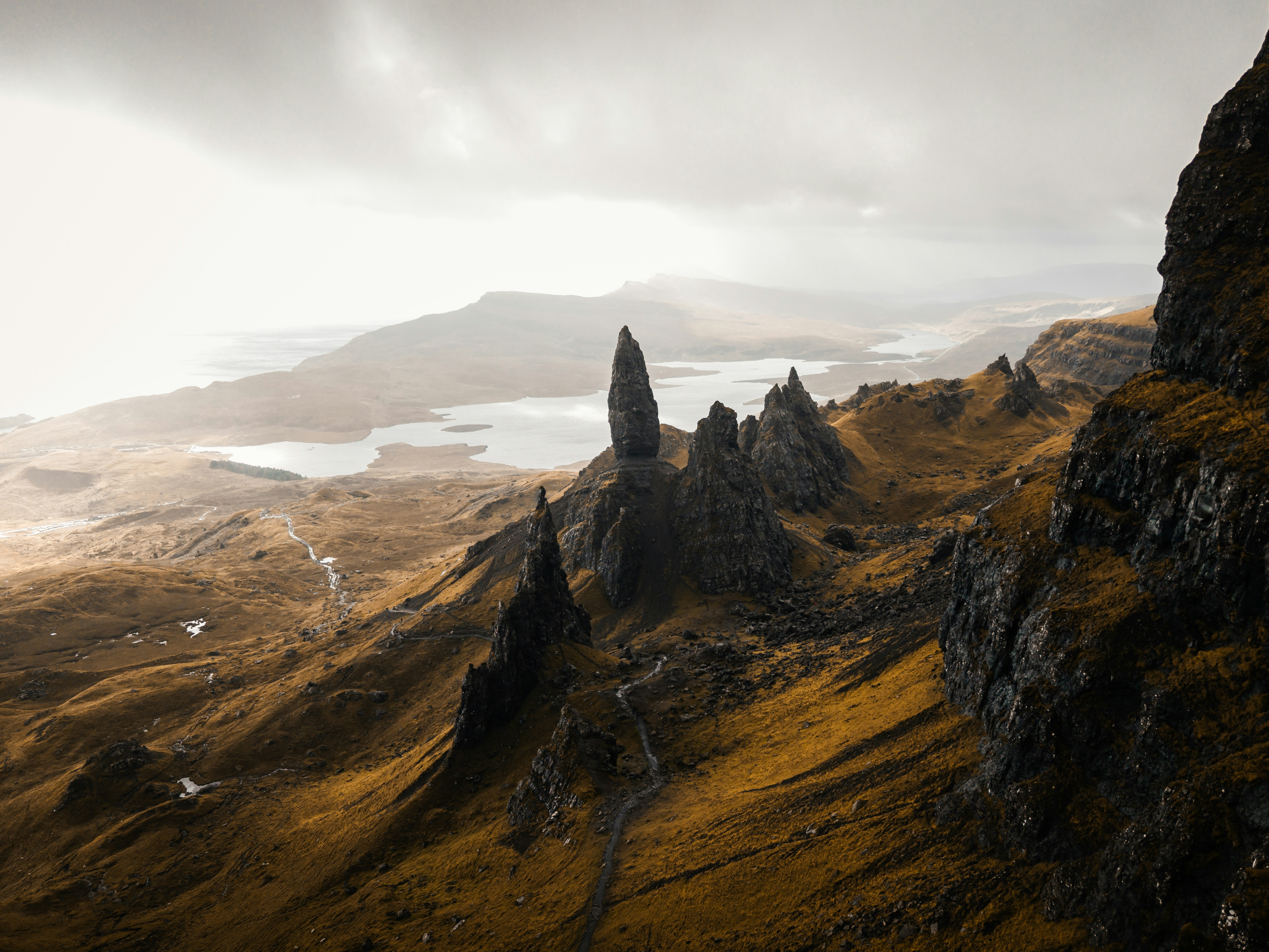 Rocky pinnacle over dramatic mountain landscape - Free Photo on Unsplash