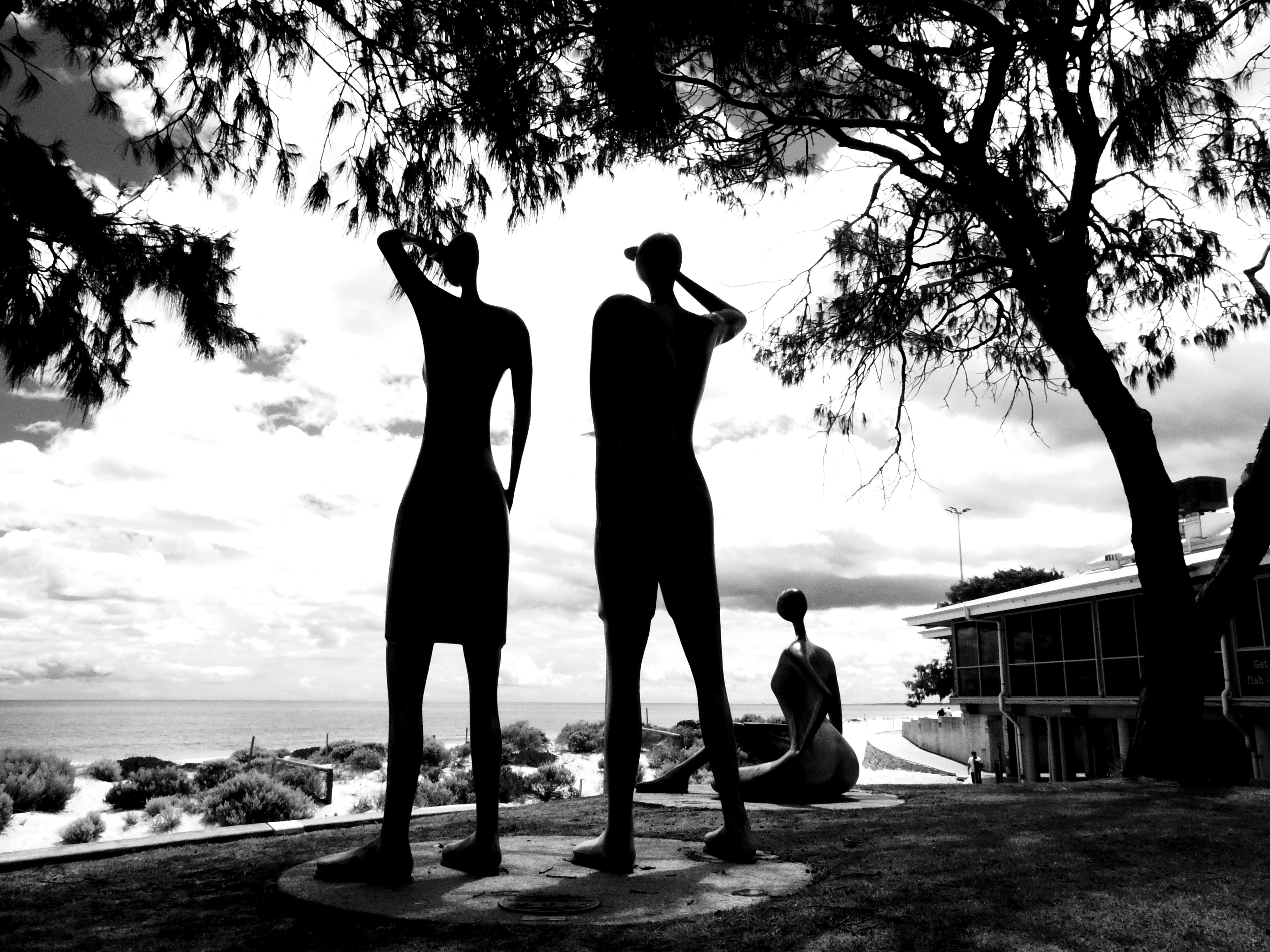Human sculptures in silhouette by ocean - Free Photo on Unsplash