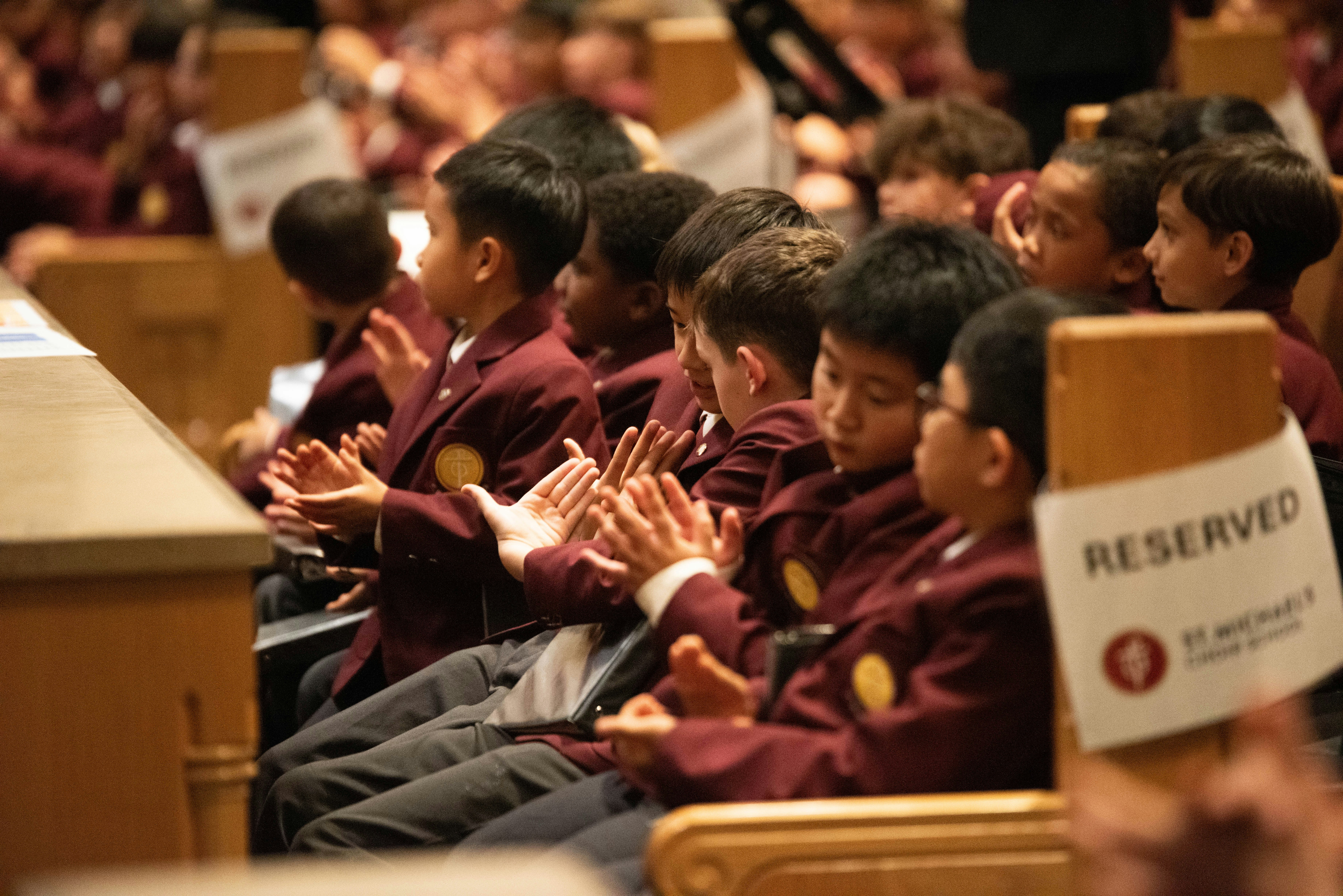 Children in maroon blazers clapping - Free Photo on Unsplash