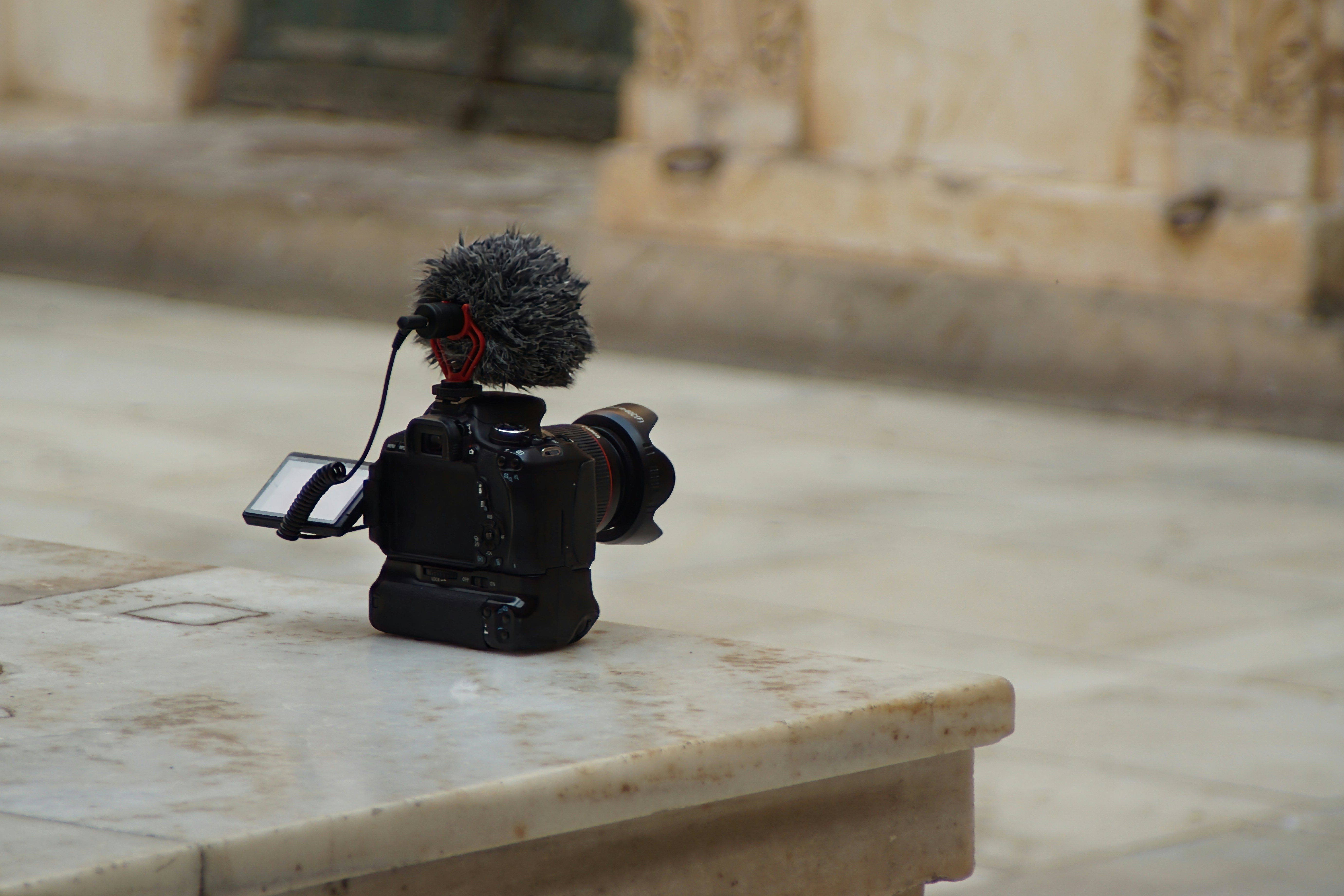 DSLR camera on marble ledge - Free Photo on Unsplash