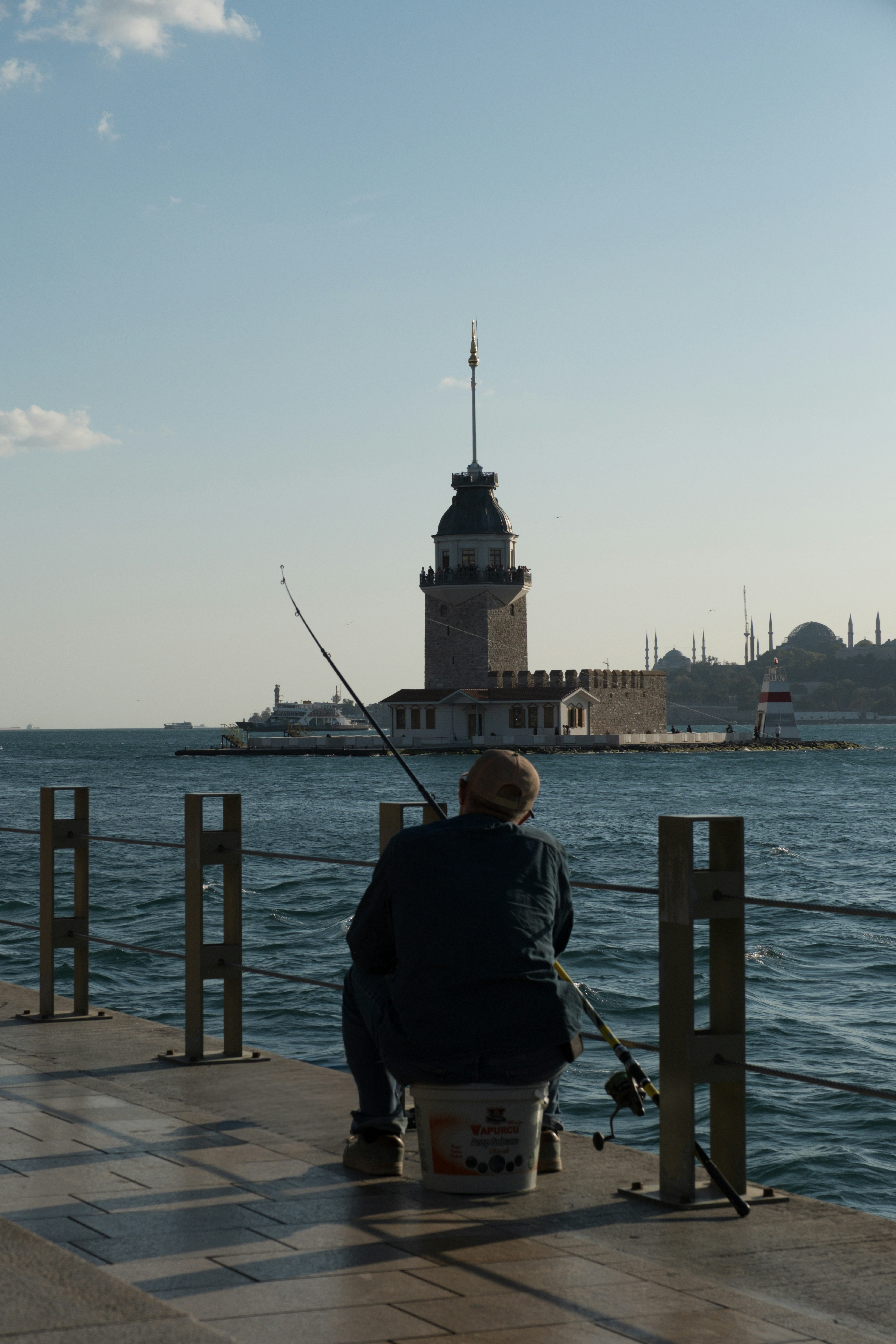 Person fishing near Maiden's Tower Istanbul - Free Photo on Unsplash