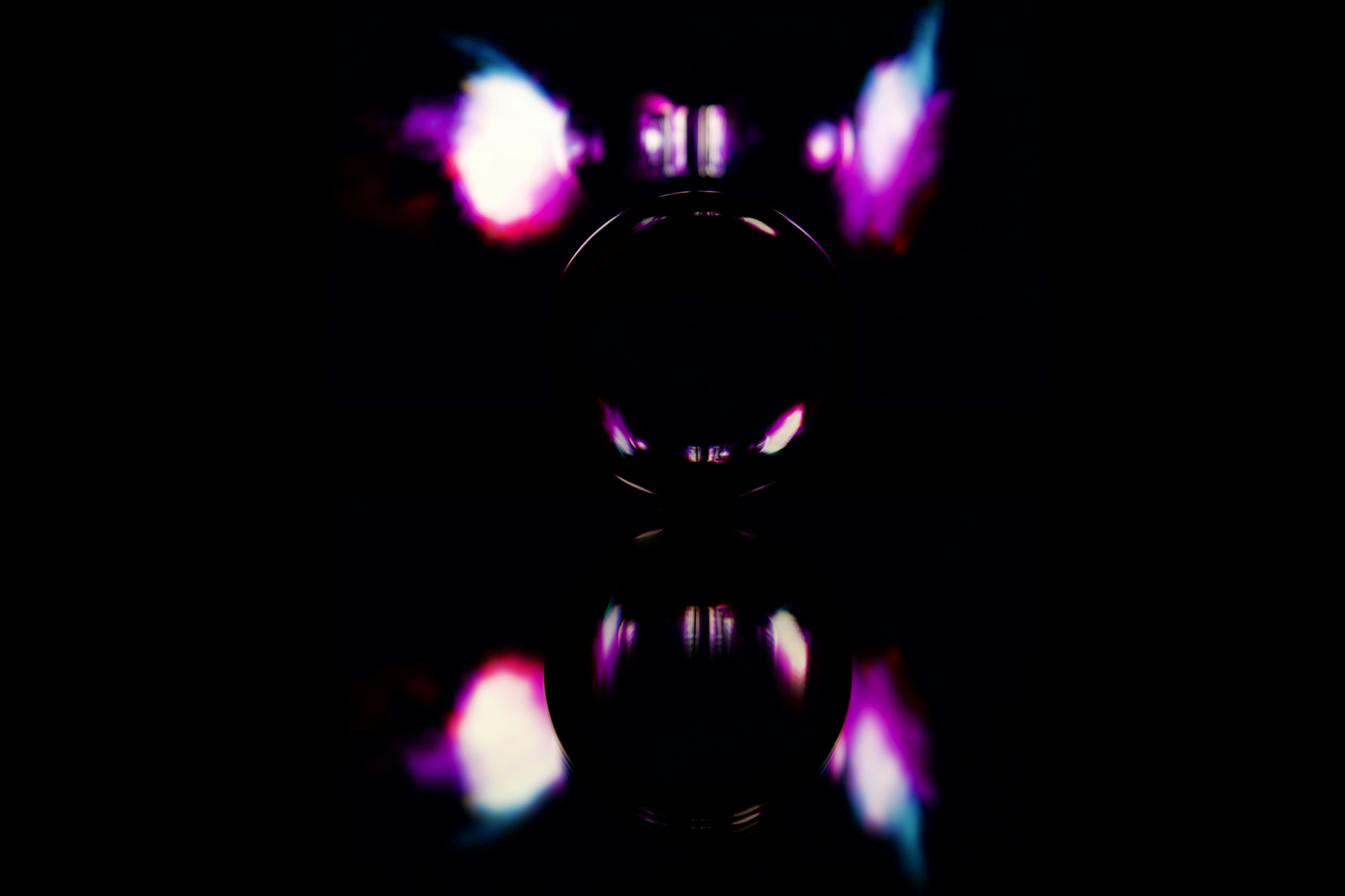 Glass sphere reflecting purple light - Free Photo on Unsplash