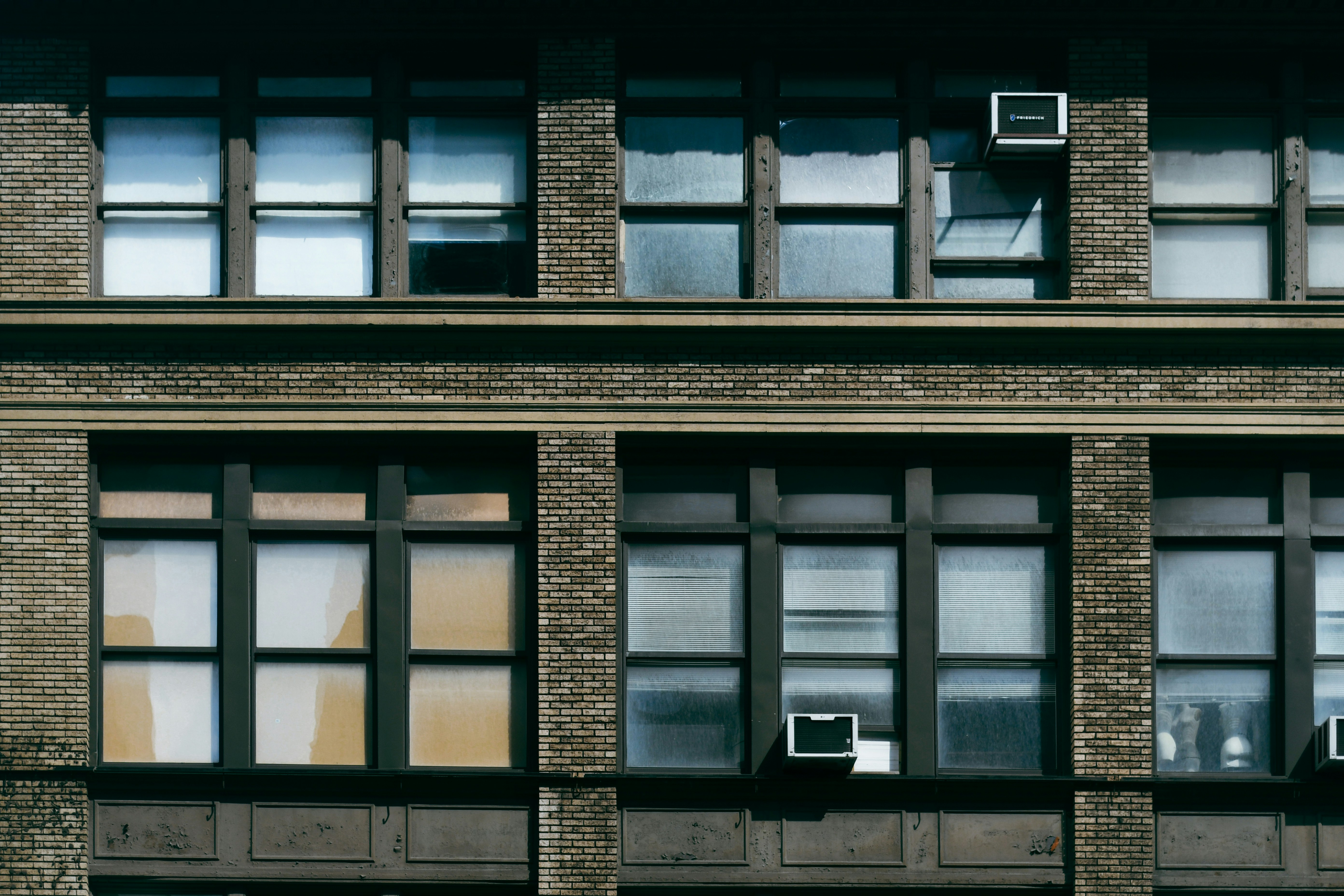 Brick building facade with window rows - Free Photo on Unsplash