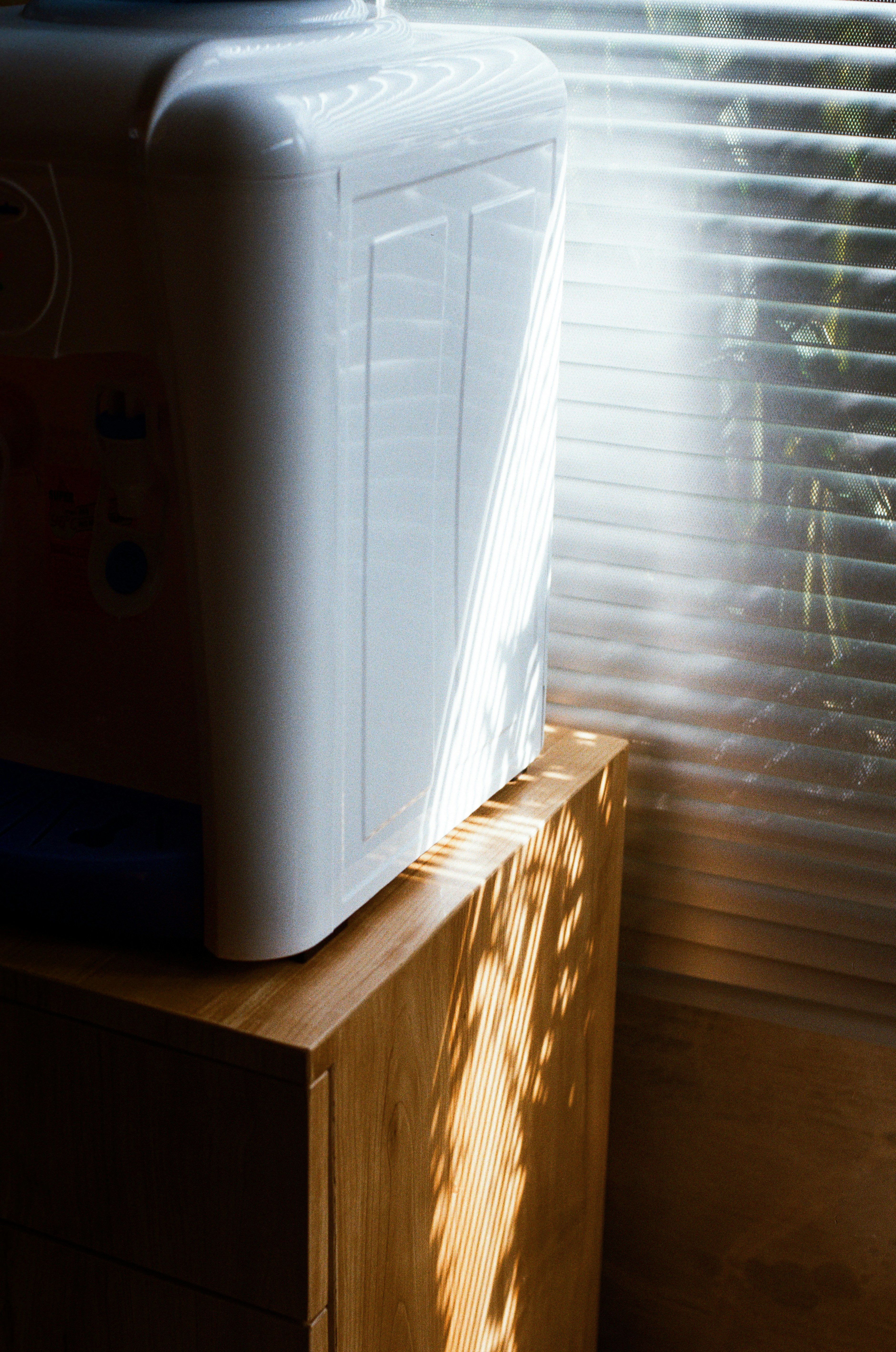 White water dispenser on wooden cabinet - Free Photo on Unsplash