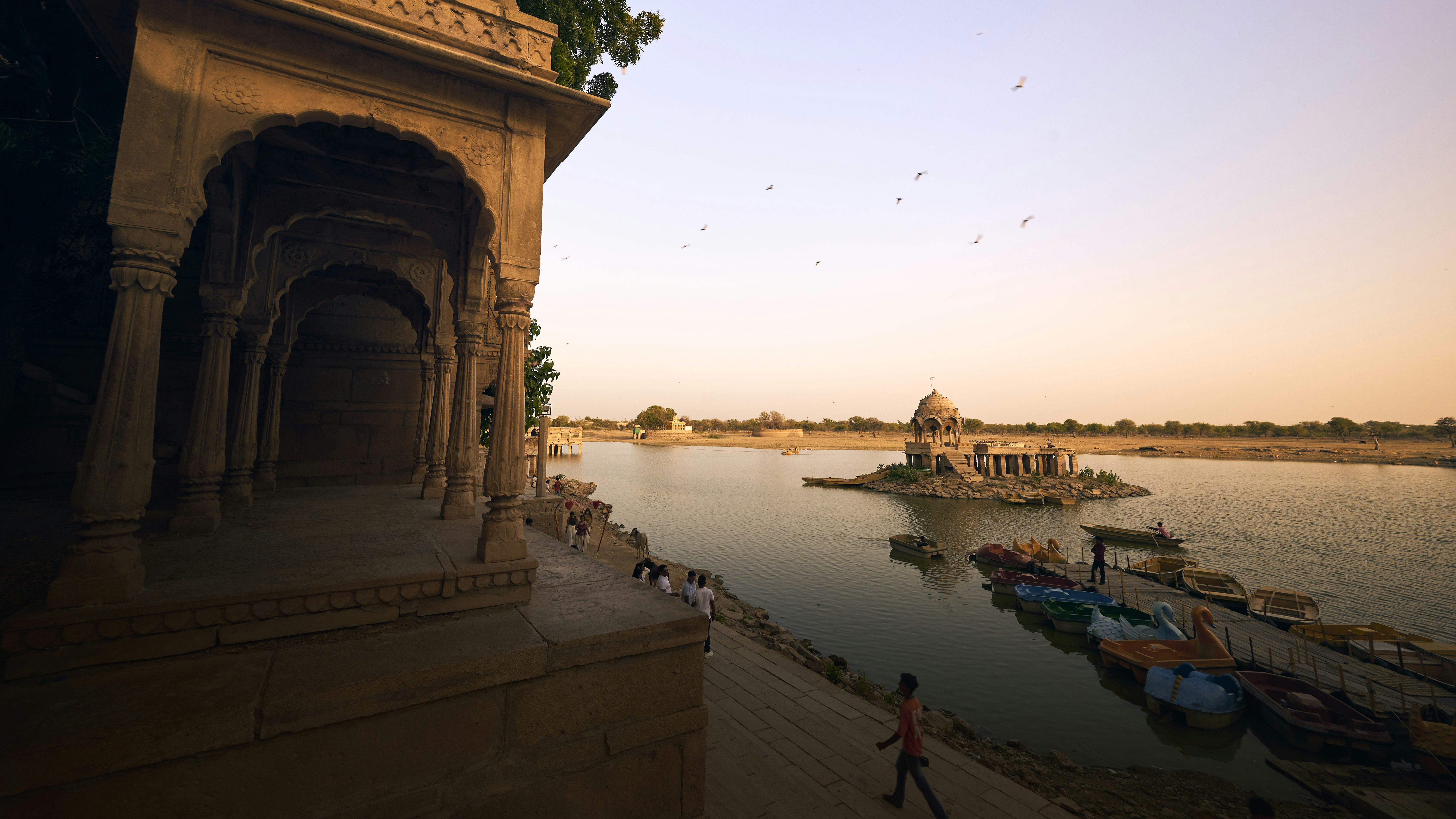 Stone pavilion overlooking temple lake - Free Photo on Unsplash