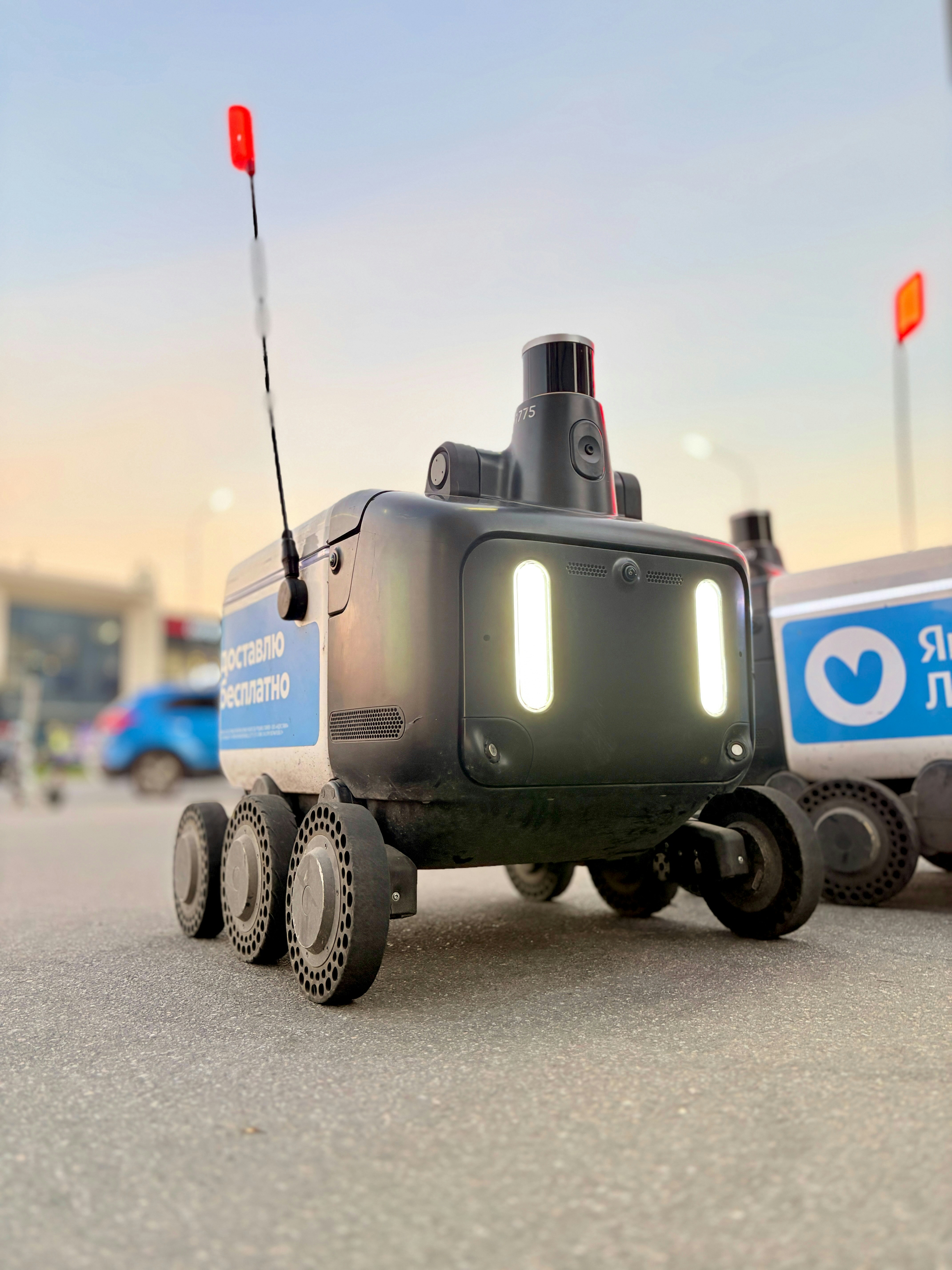 Autonomous delivery robot on paved street - Free Photo on Unsplash