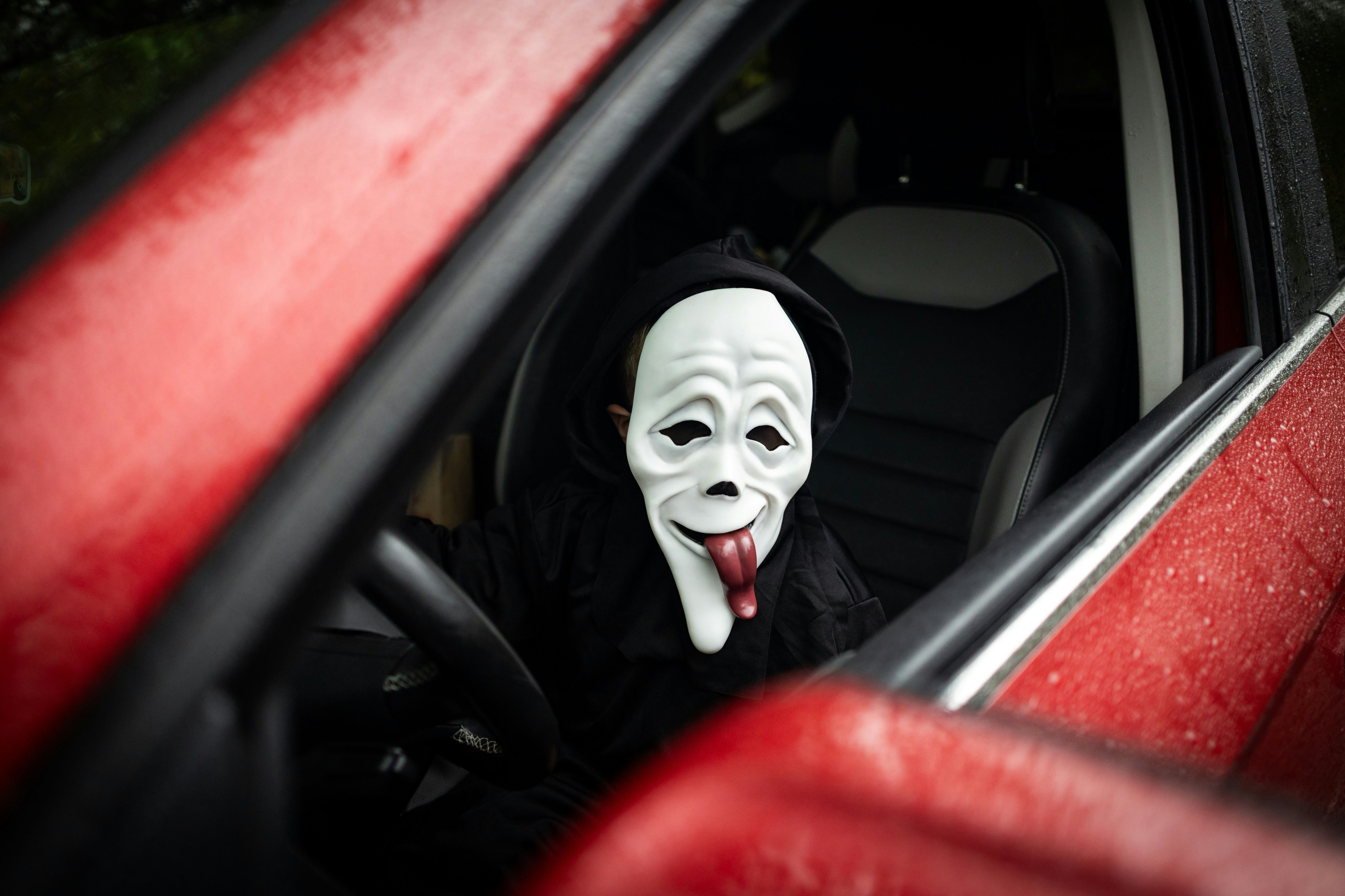 Person in ghost mask driving car - Free Photo on Unsplash