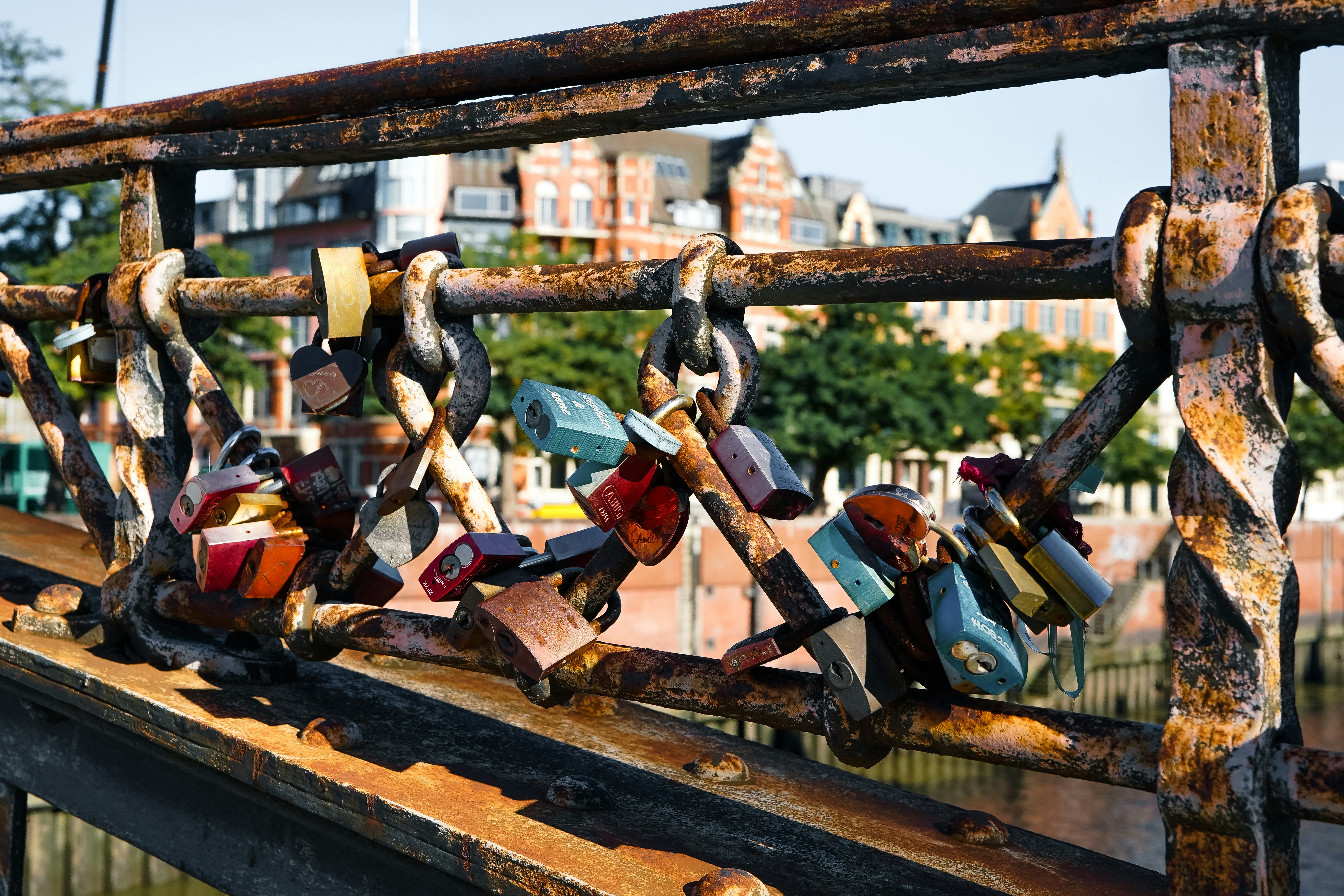 Colorful love padlocks on rusted railing - Free Photo on Unsplash