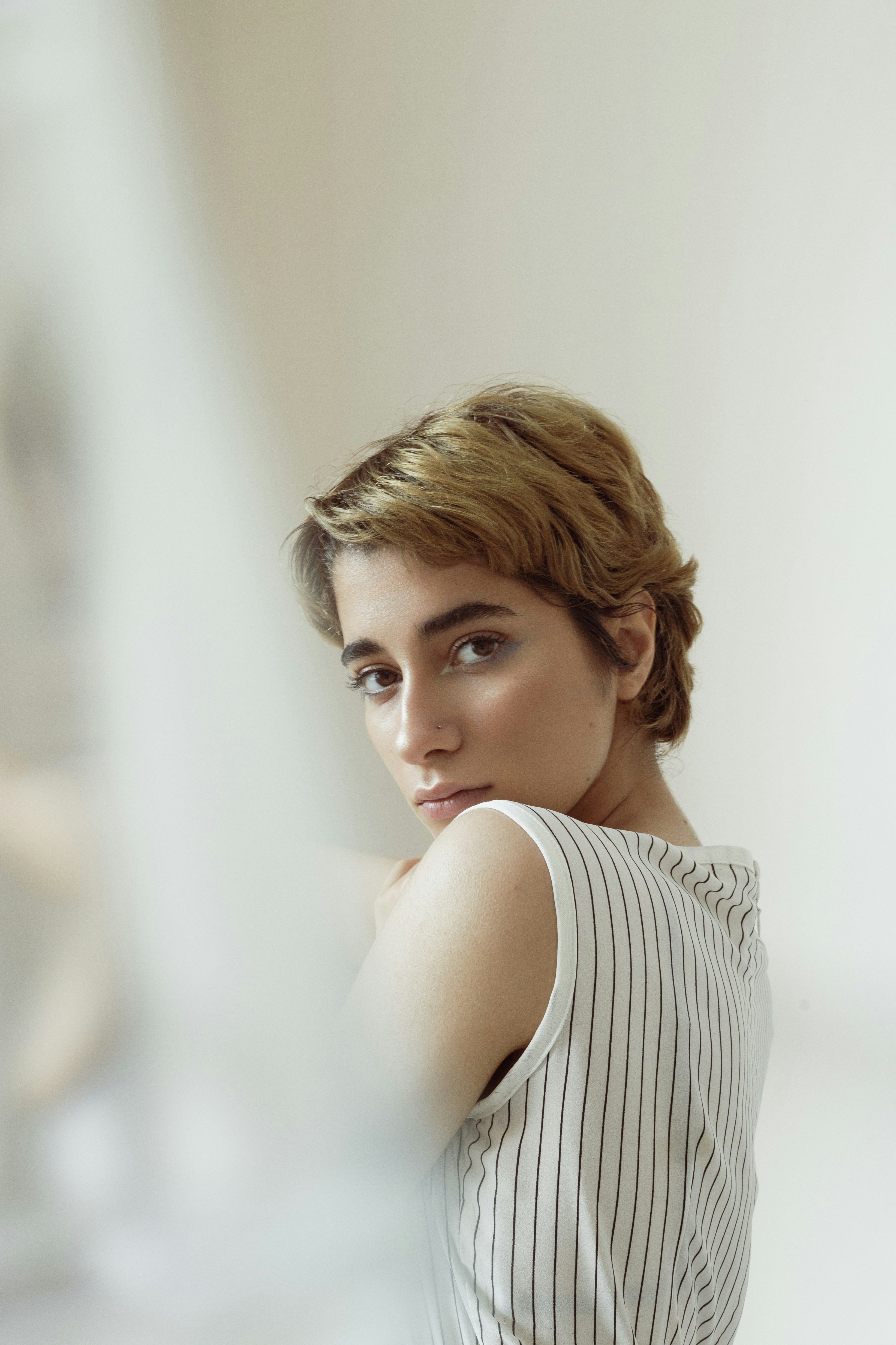 Woman with short hair in stripes - Free Photo on Unsplash