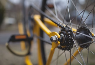 yellow and black bicycle close-up photography