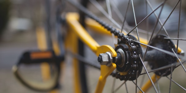 yellow and black bicycle close-up photography