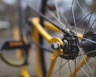yellow and black bicycle close-up photography
