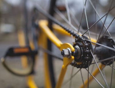 yellow and black bicycle close-up photography