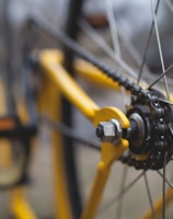 yellow and black bicycle close-up photography