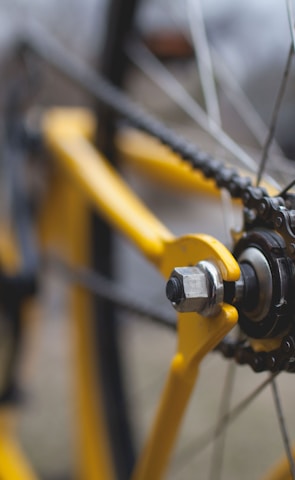yellow and black bicycle close-up photography