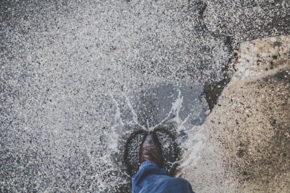 person stepping on wet ground