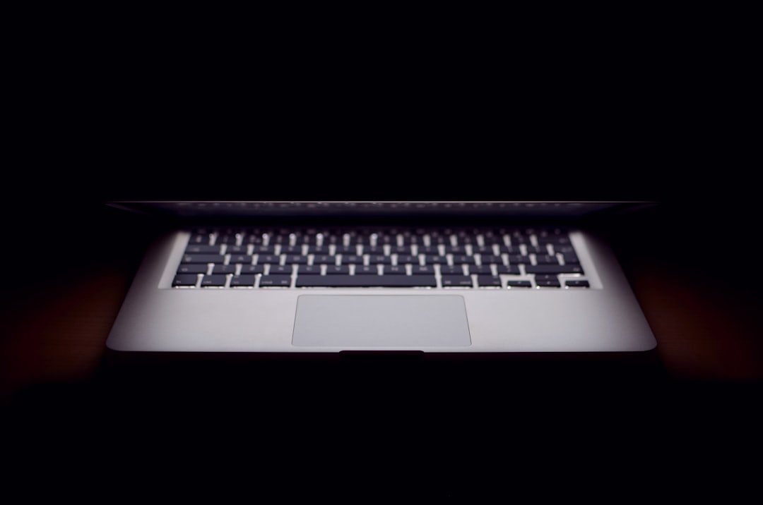 slightly opened MacBook Air, half closed laptop