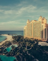 yellow concrete building beside body of water