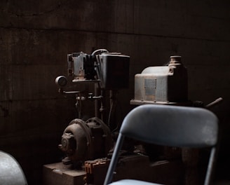 AC motor-powered machine behind chair