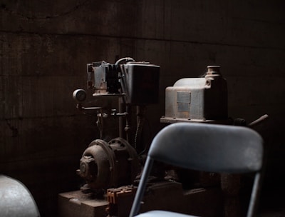 AC motor-powered machine behind chair