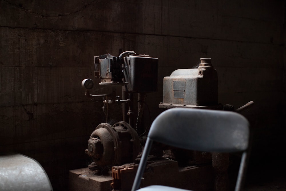 AC motor-powered machine behind chair