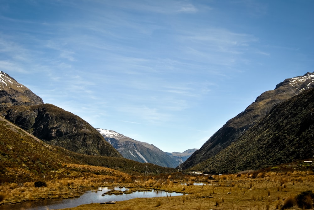 body of water near mountains