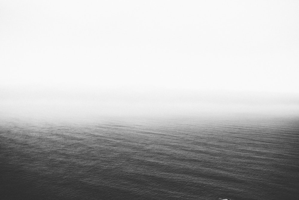 grayscale photography of body of water