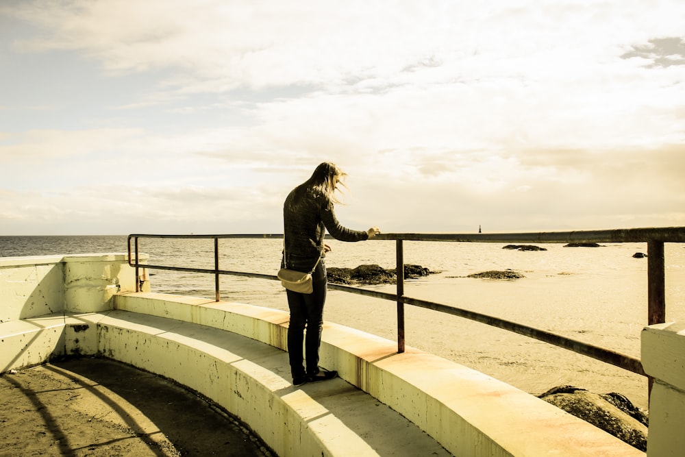 person standing on building rooftop during daytime