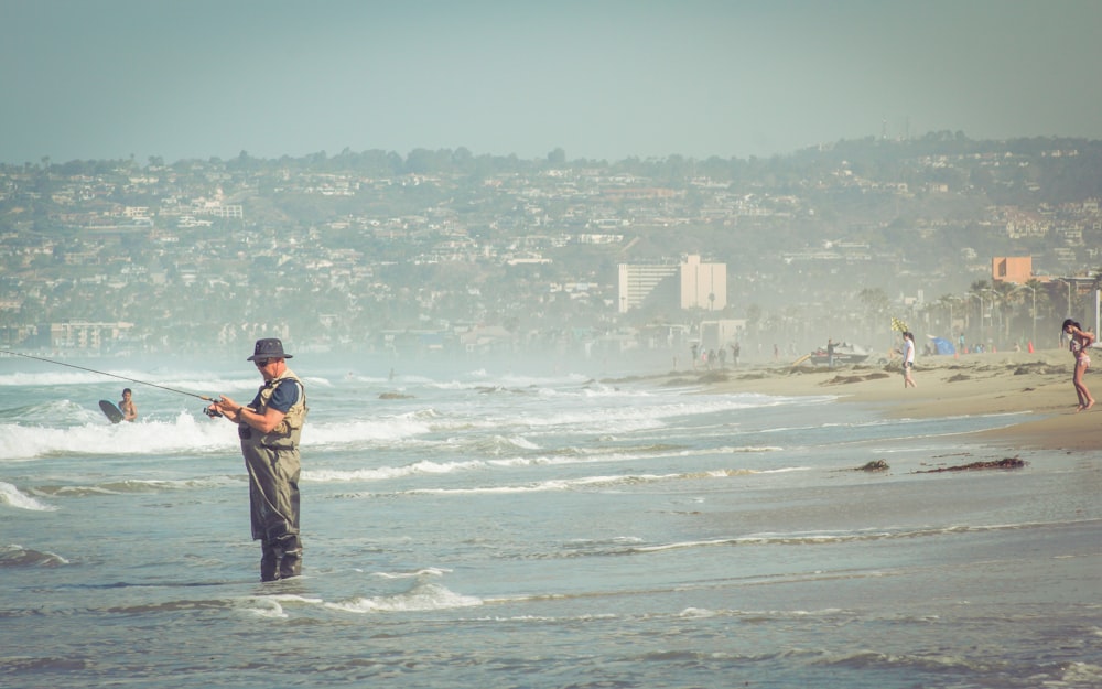 man standing on seashire