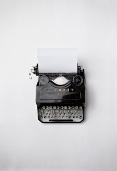 black Fayorit typewriter with printer paper