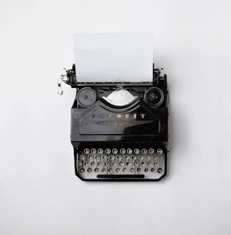 black Fayorit typewriter with printer paper