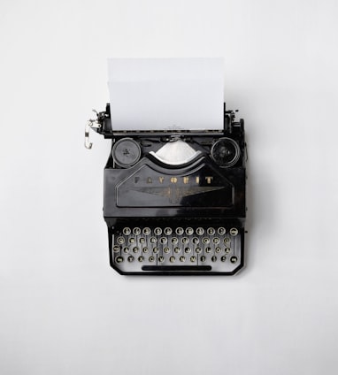 black Fayorit typewriter with printer paper
